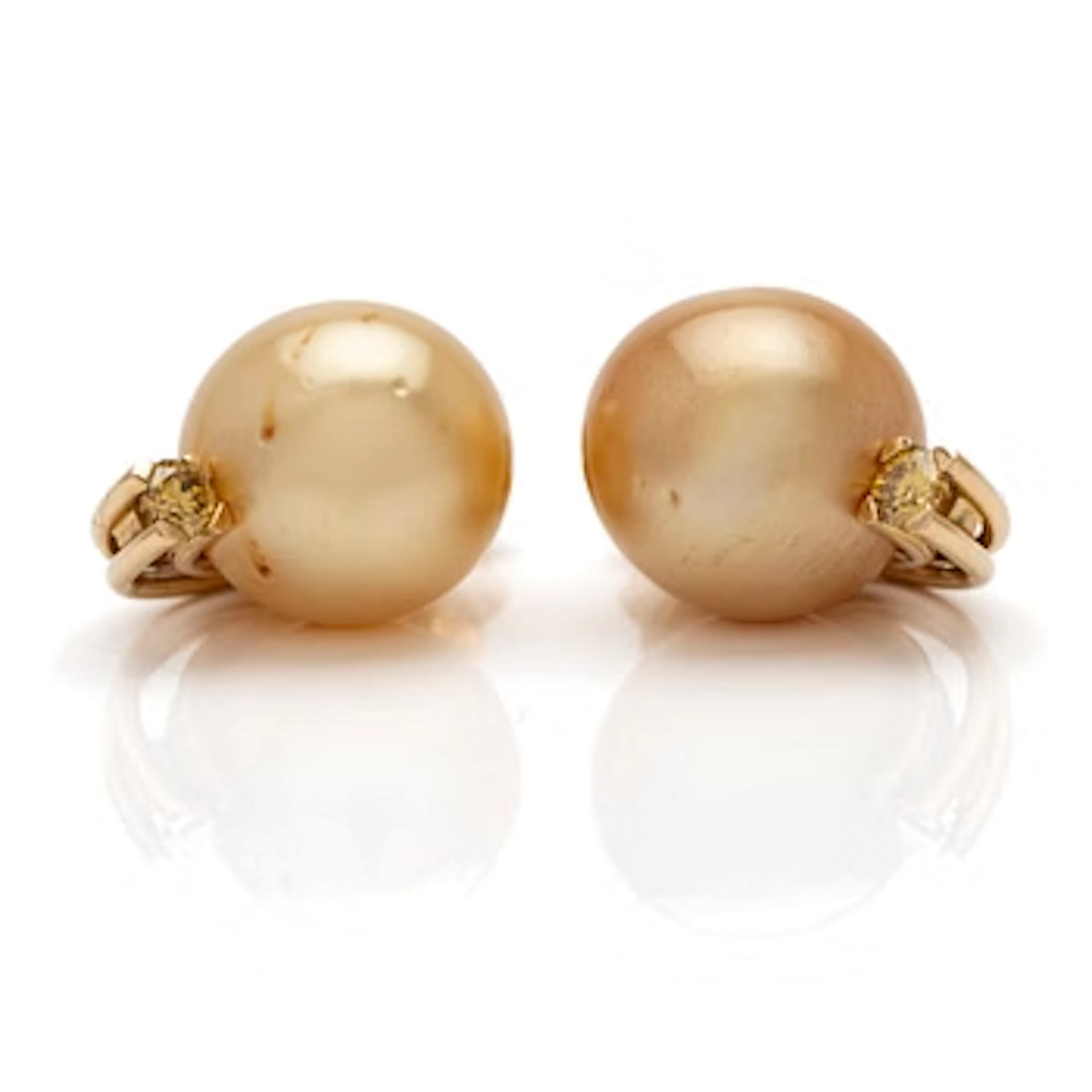 18K gold earrings with South Sea pearls and diamonds.