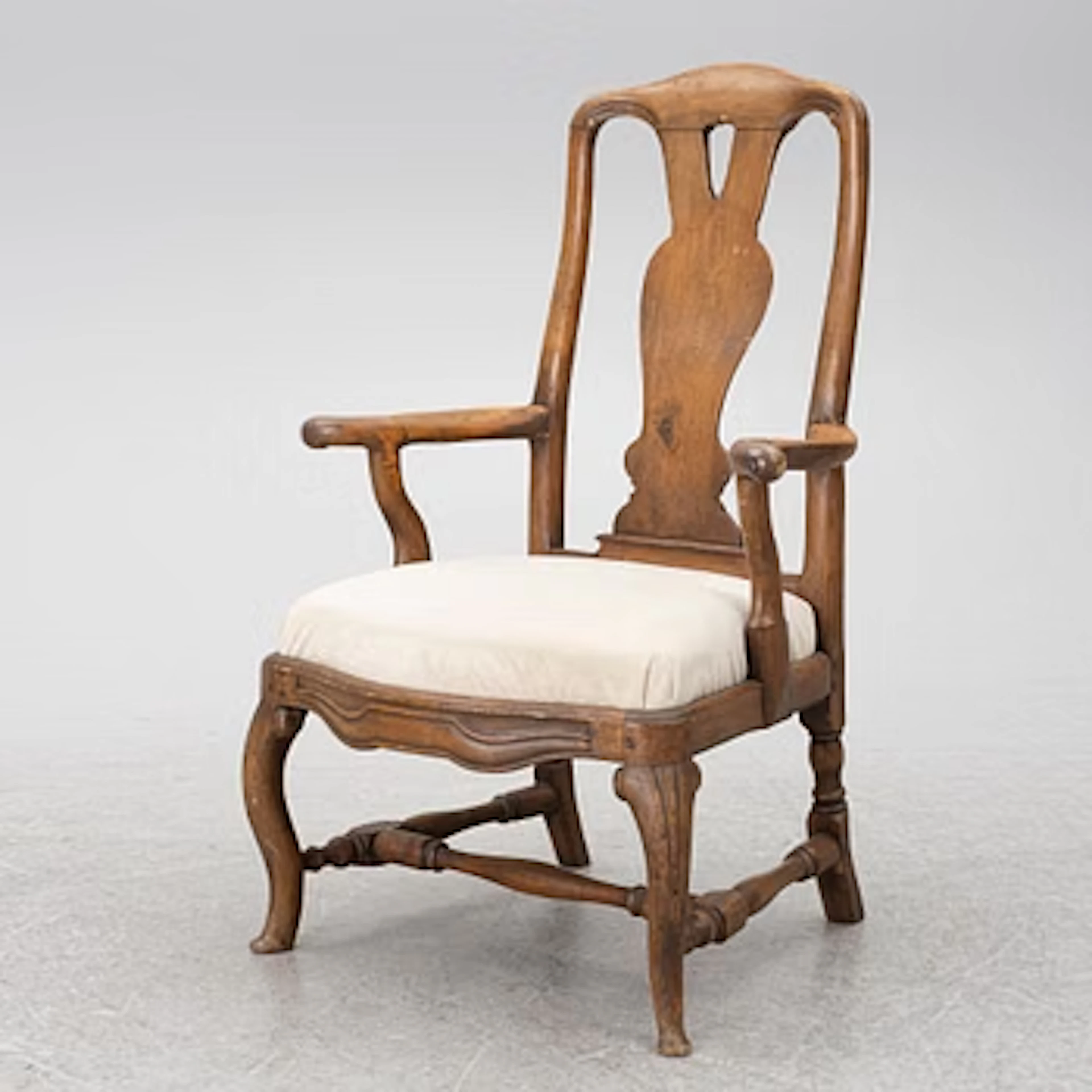 A Rocoo open armchair, Stockholm, later part 18th century.