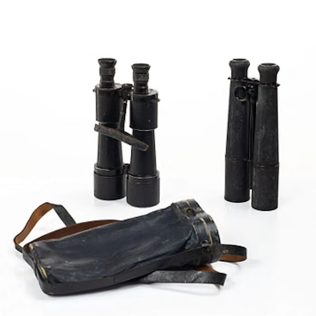 Two binoculars, Carl Zeiss Jena DE 10x50 and a French 19th-century telescope.