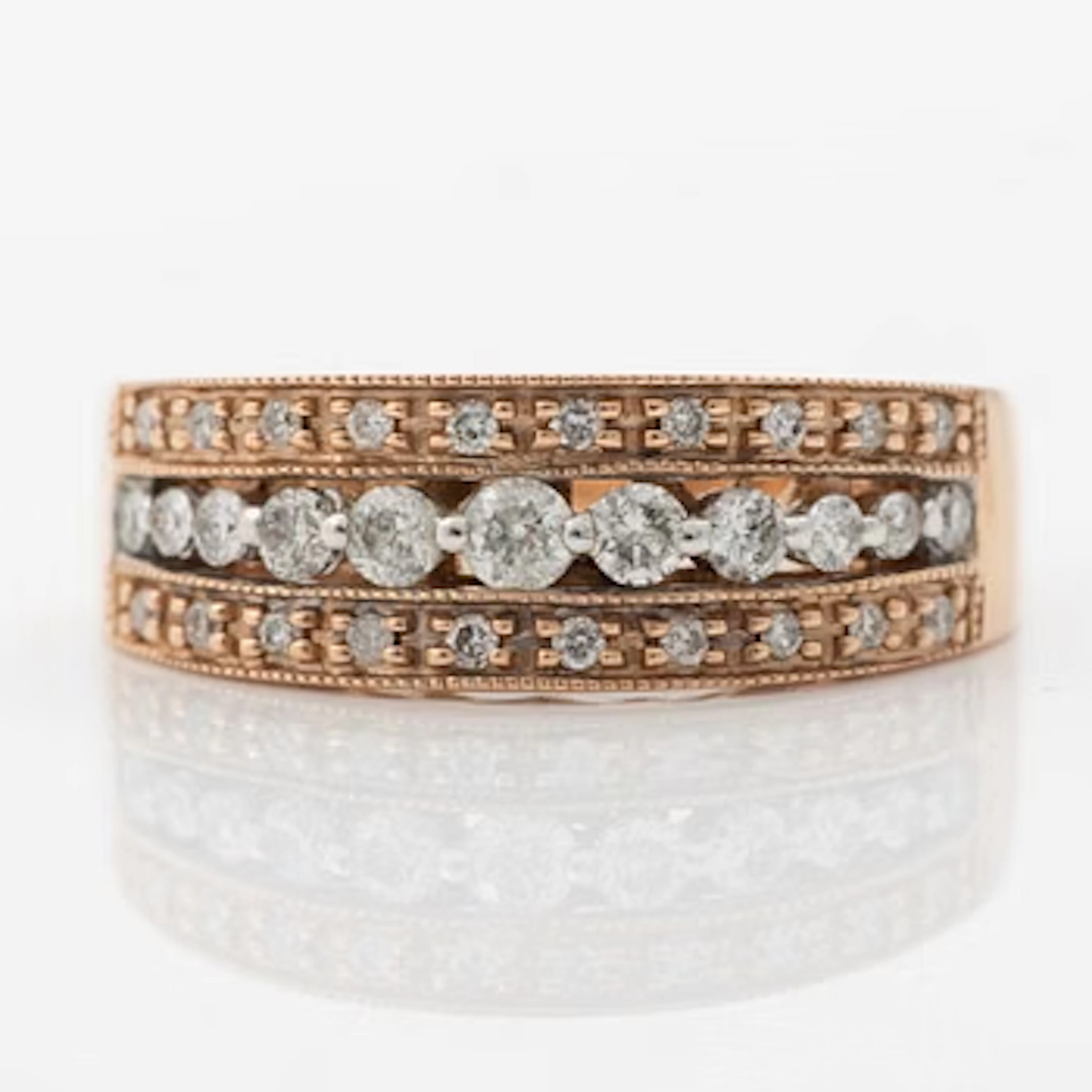 14K rose gold ring with round brilliant-cut diamonds.