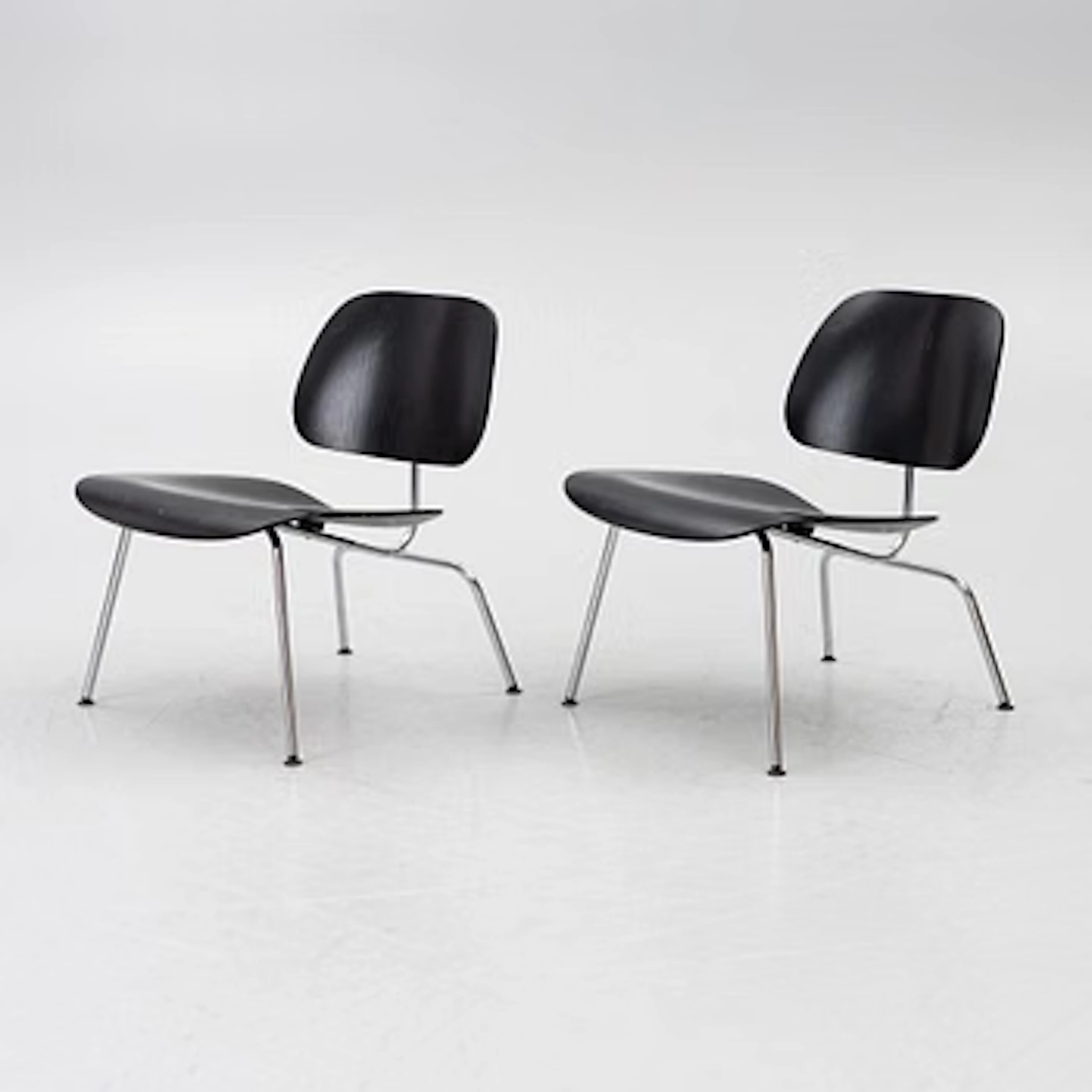 Charles & Ray Eames, Chairs, a pair, "LCM", Vitra, 2003.