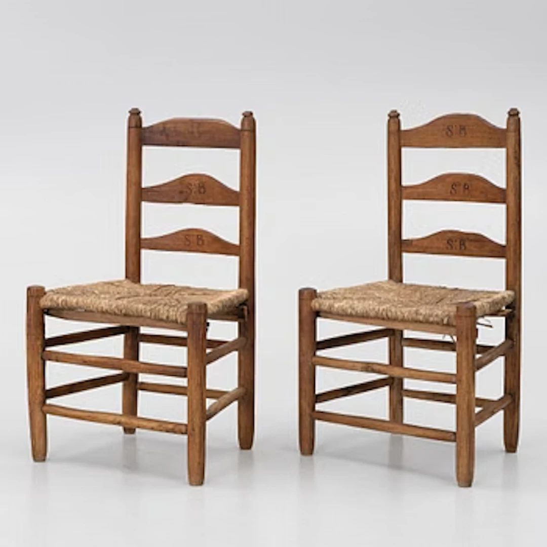 A pair of child-size ladder back chairs, circa 1800.