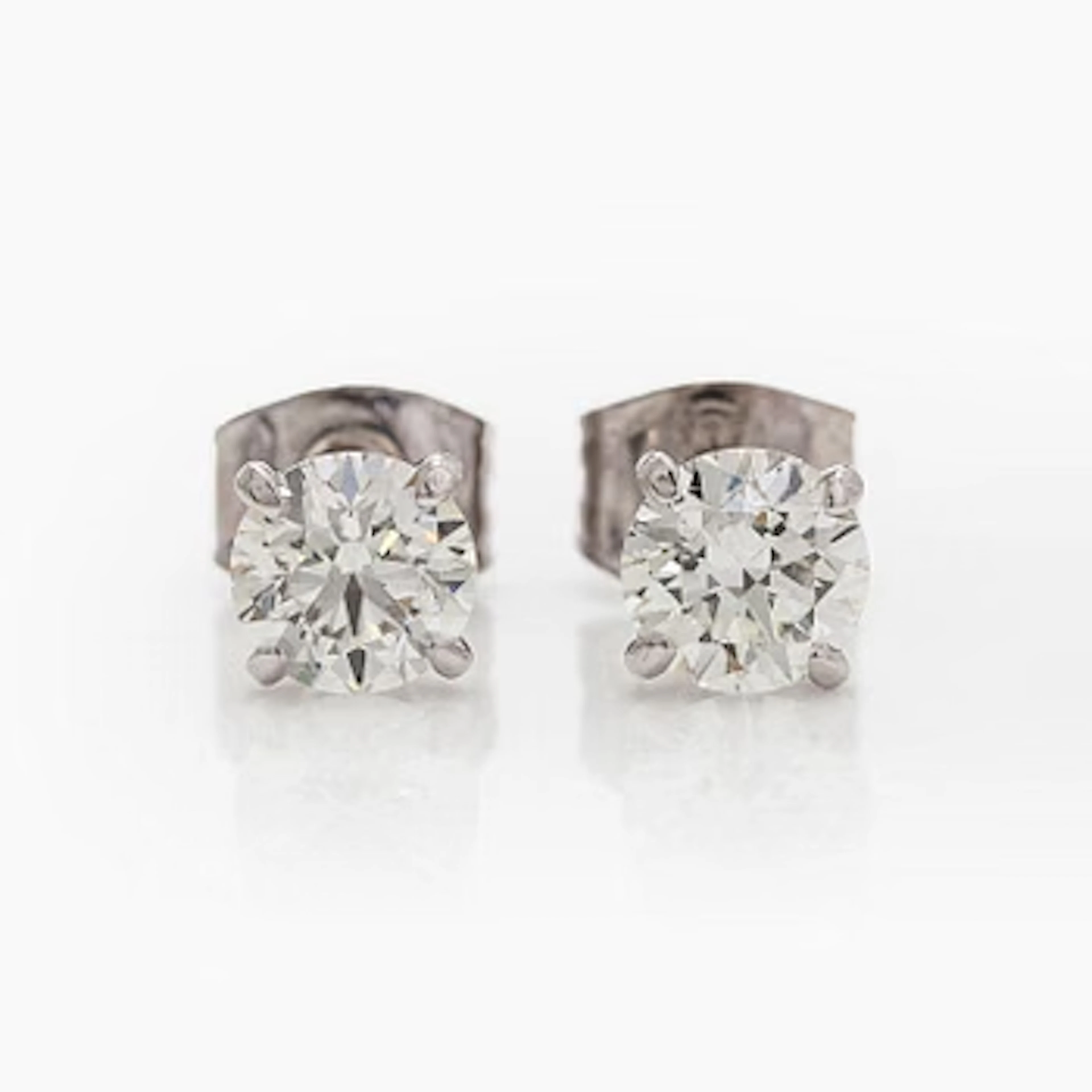 Earrings, brilliant cut diamonds totalling 1.20 ct, 14K white gold.