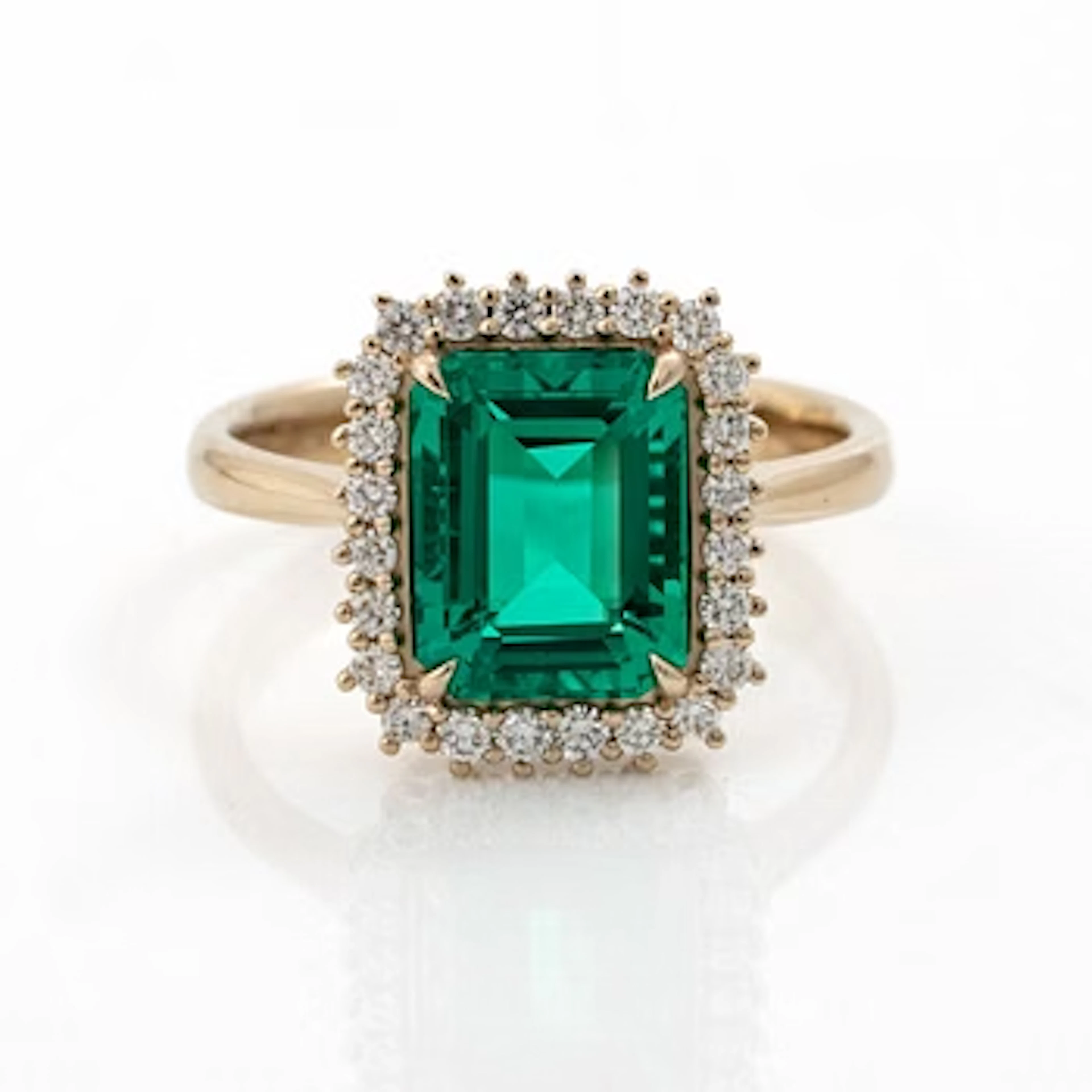 Ring 18K white gold with synthetic emerald and brilliant-cut diamonds.
