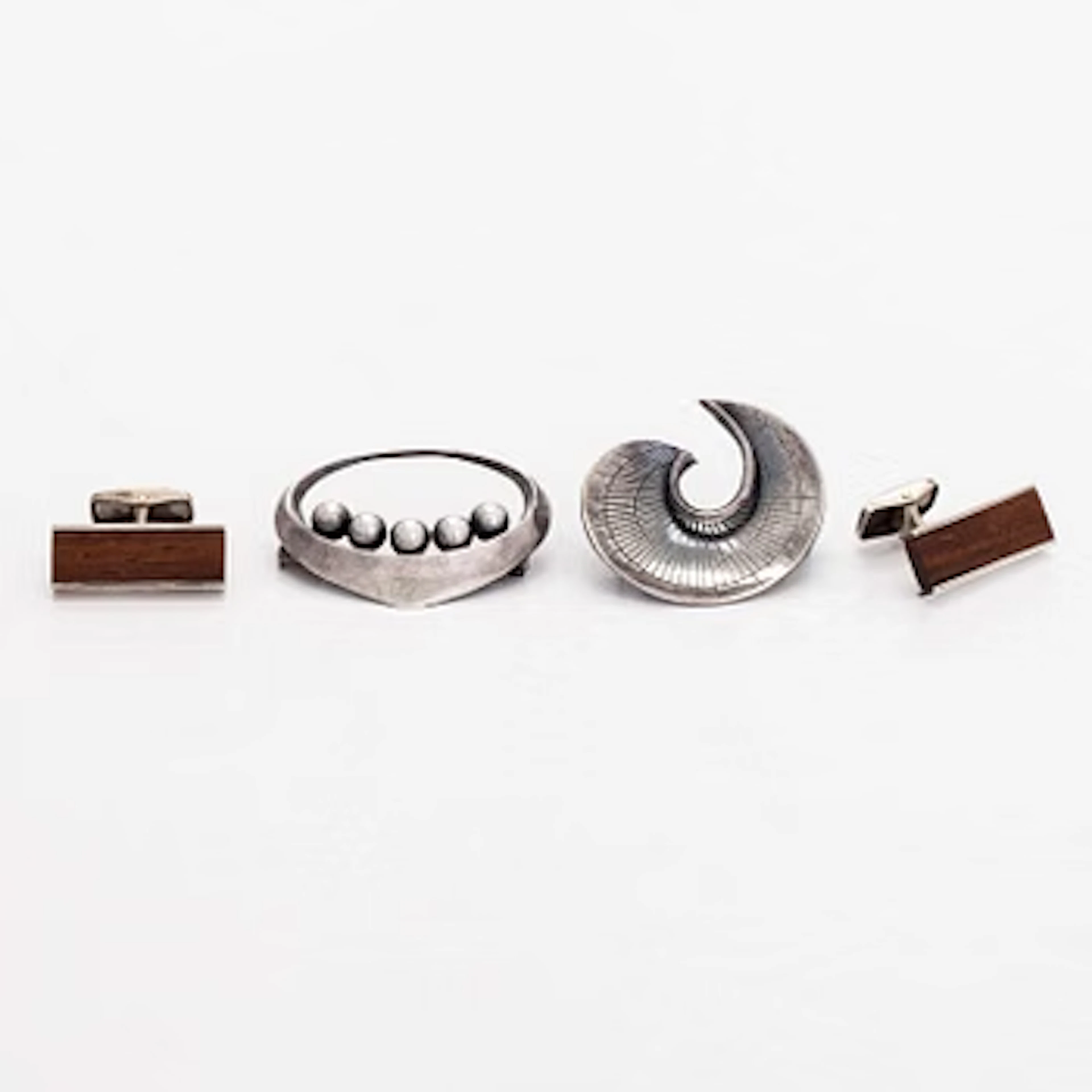 Erik Granit, Brooches and cufflinks, silver, wood, Helsinki, 1960s.