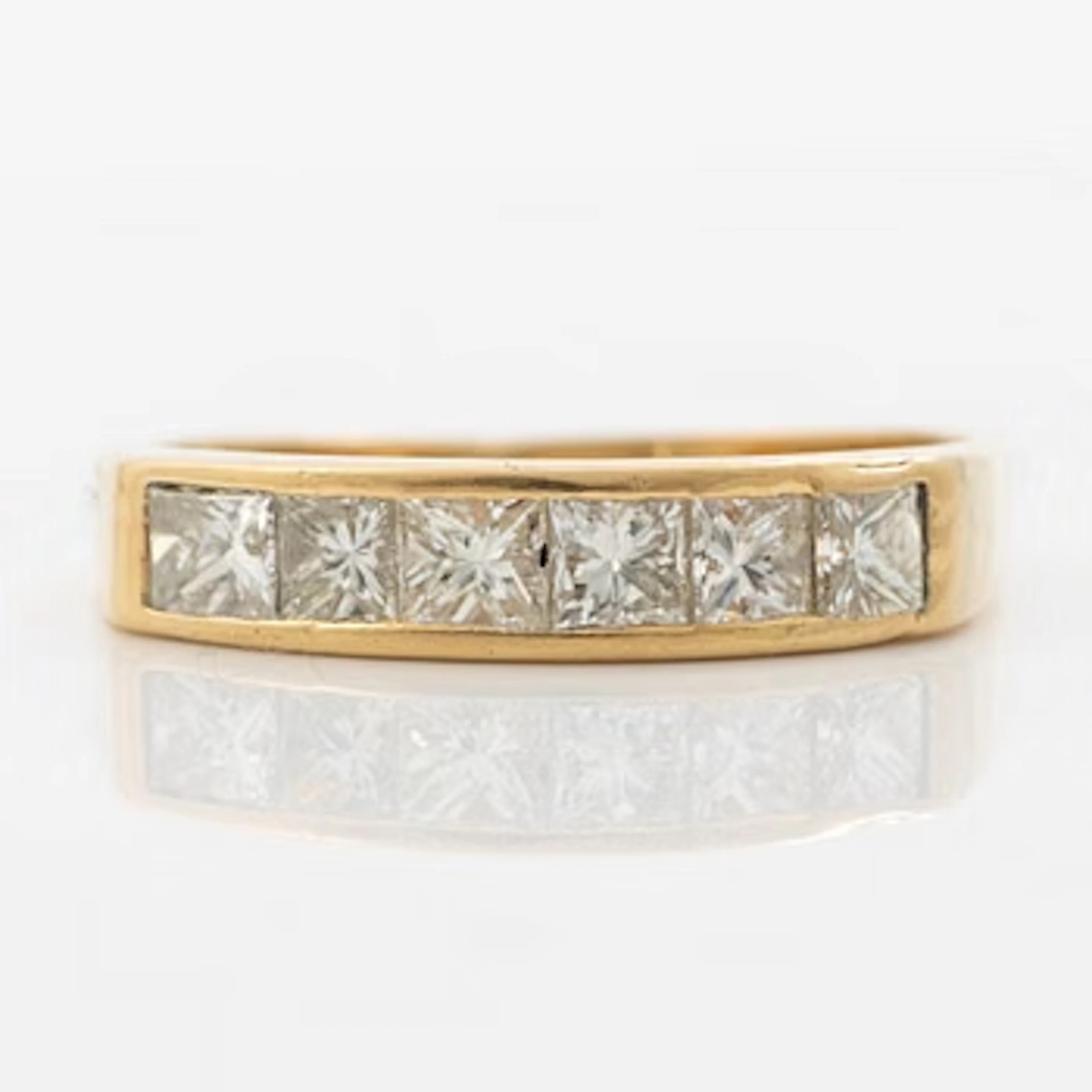 14K gold ring with princess-cut diamonds.