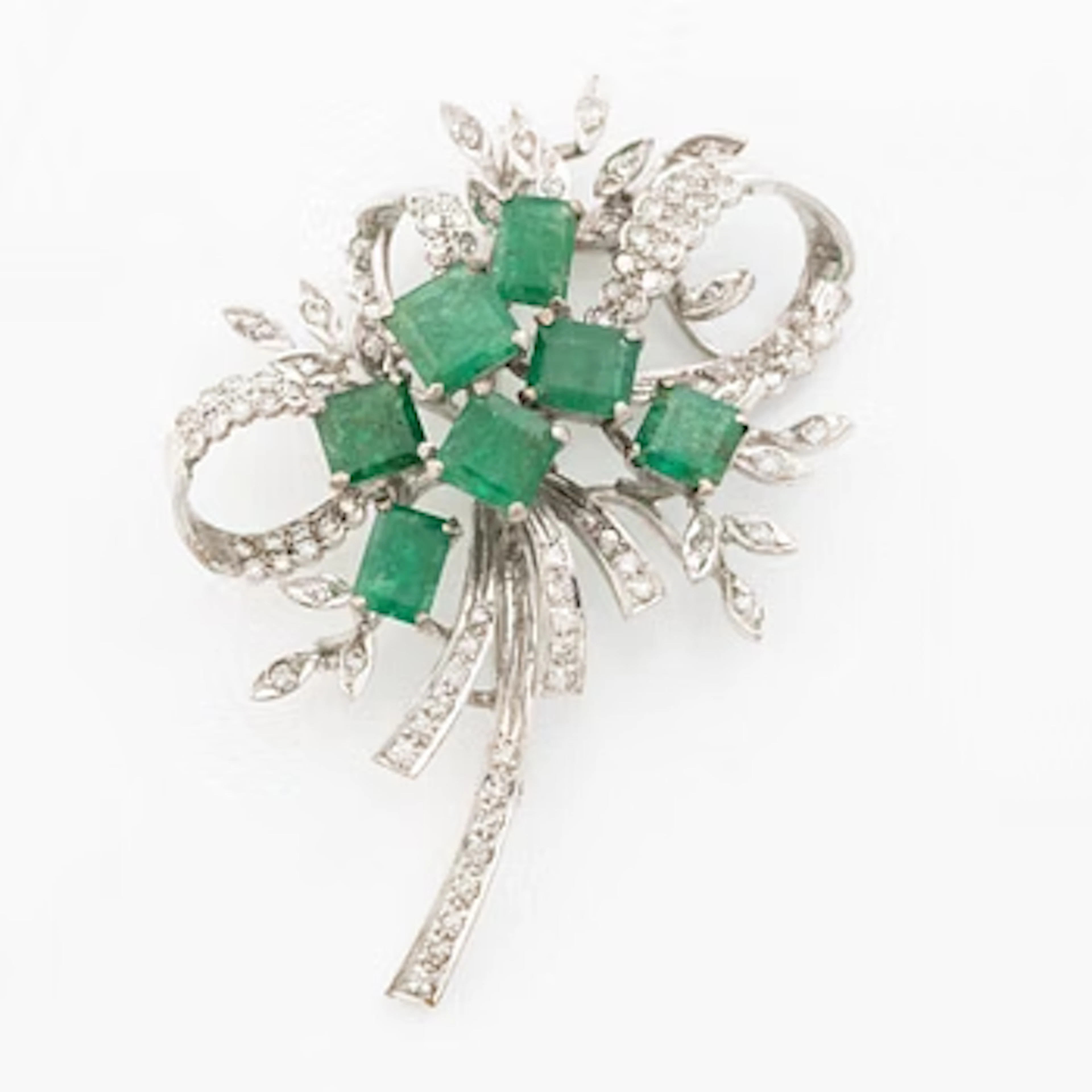 Brooch, 18K white gold with emeralds and octagonal-cut diamonds.