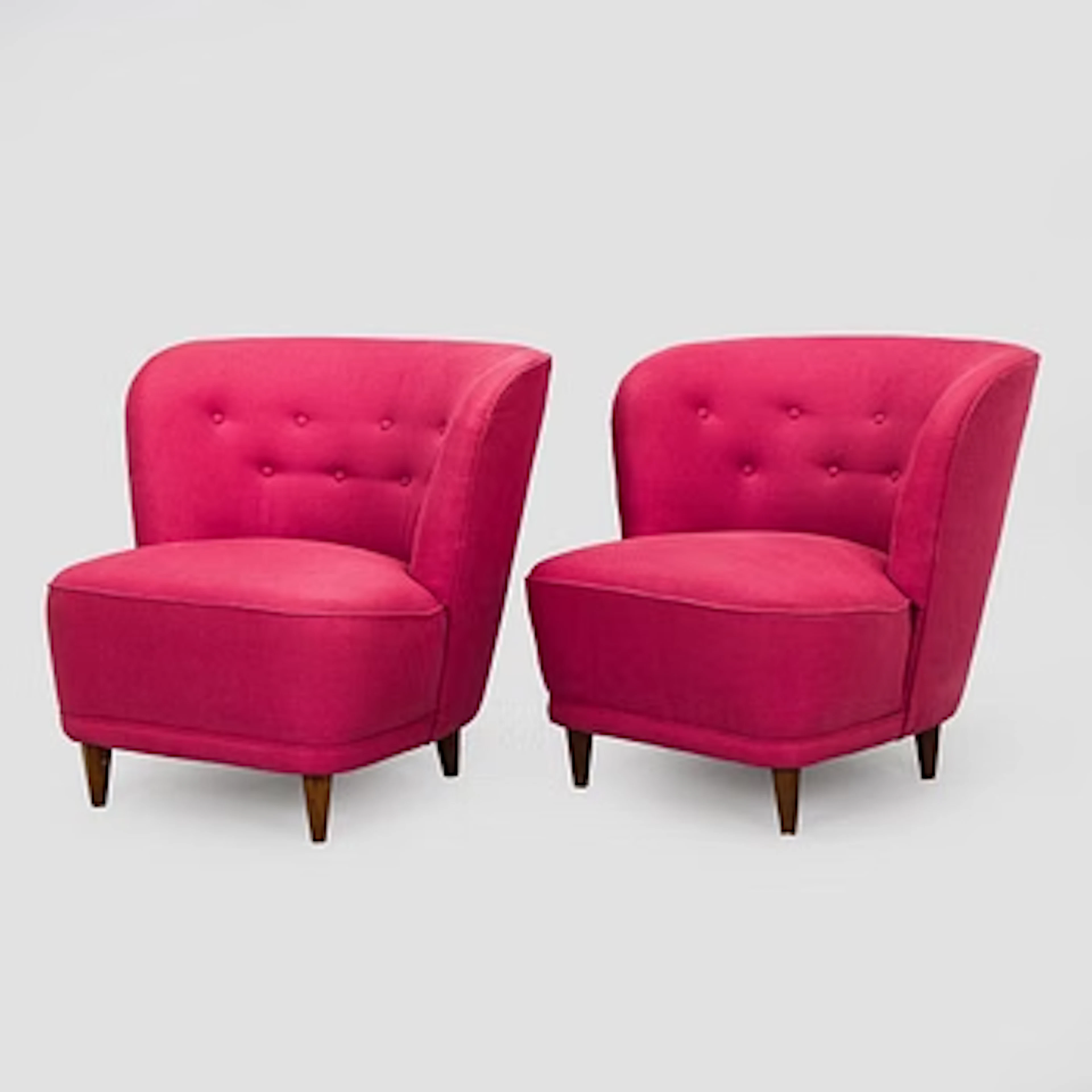 A pair of mid-20th century armchairs.