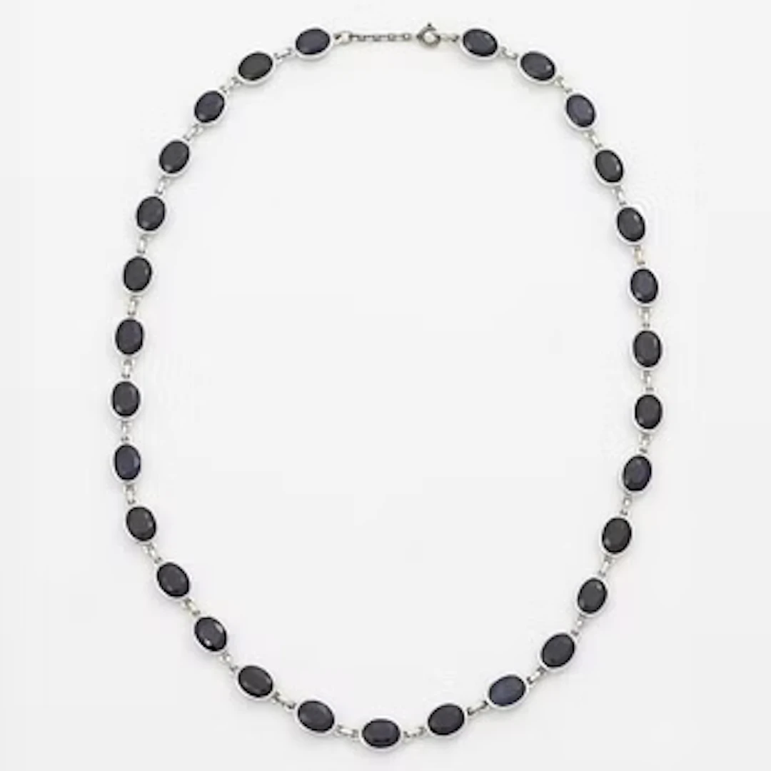 18K white gold necklace with dark sapphires.