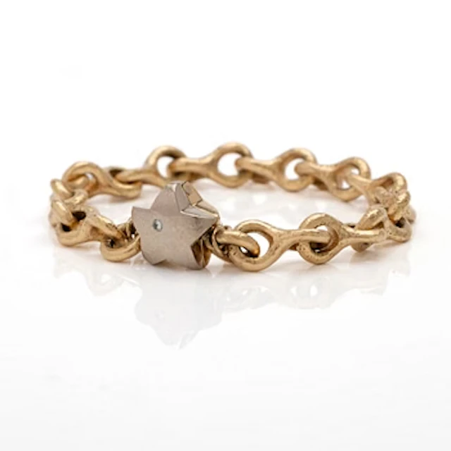 18K gold bracelet with a diamond.