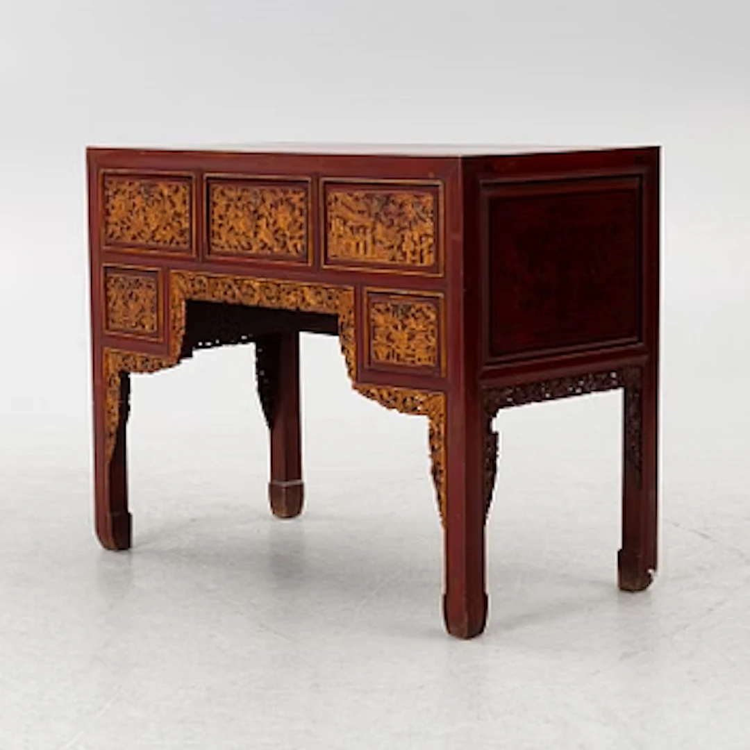 A red-lacquered desk, China, first half of the 20th century.