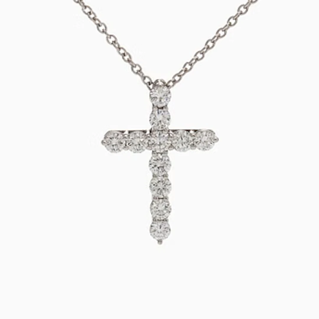 Tiffany & Co, a platinum cross pendant necklace with brilliant-cut diamonds.