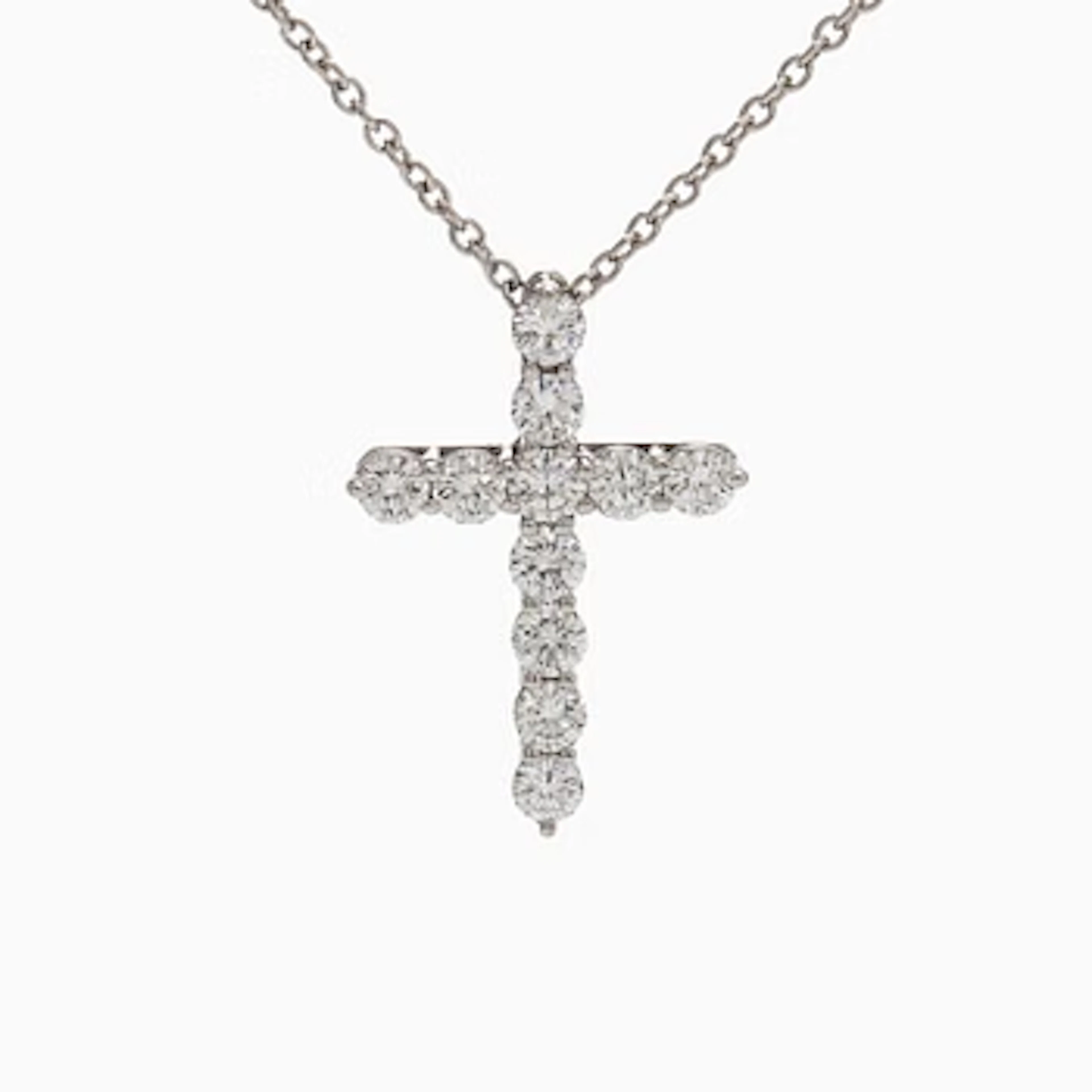 Tiffany & Co, a platinum cross pendant necklace with brilliant-cut diamonds.