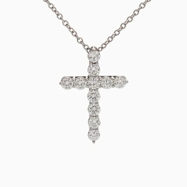 Tiffany & Co, a platinum cross pendant necklace with brilliant-cut diamonds.