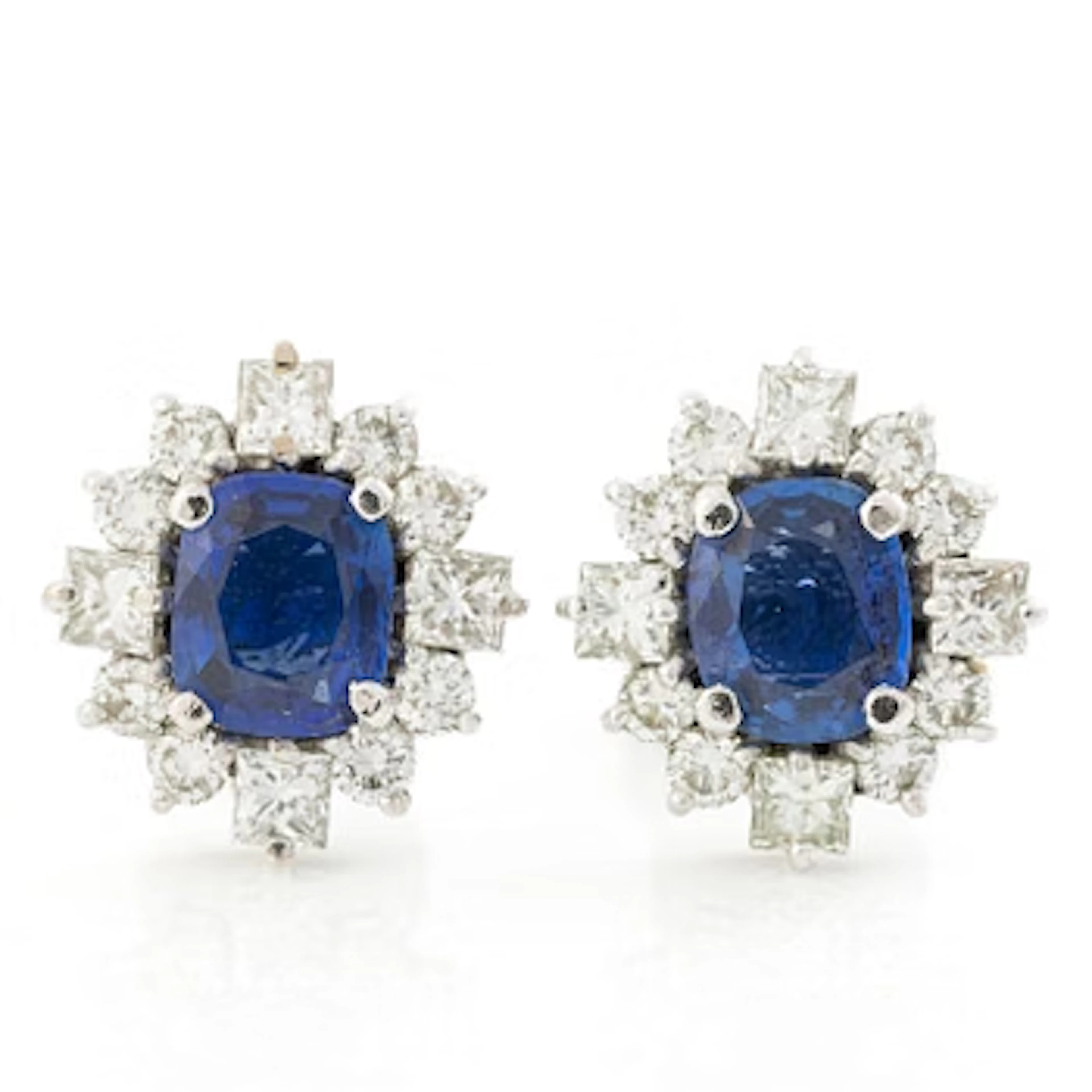 A pair of 14K gold earrings with faceted sapphires and round brilliant-