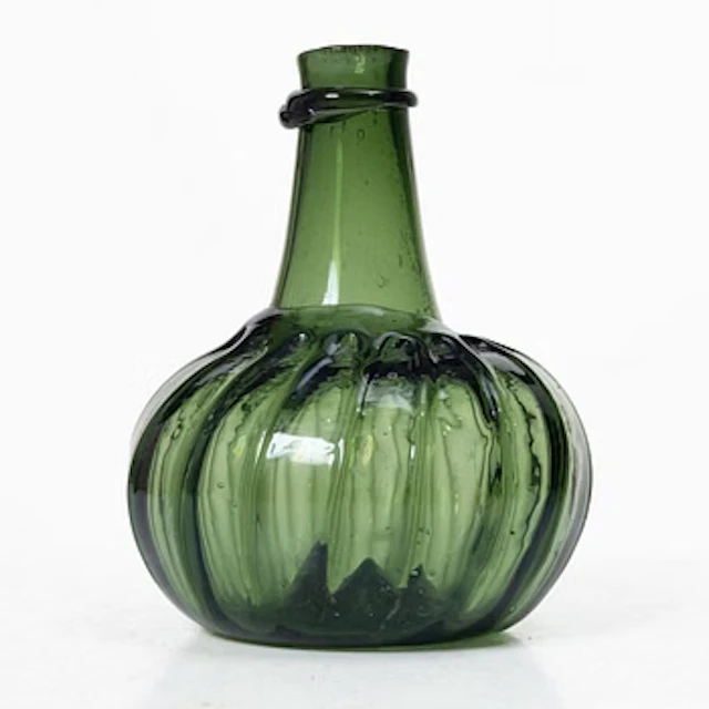 A green twisted glass bottle, 18th century.