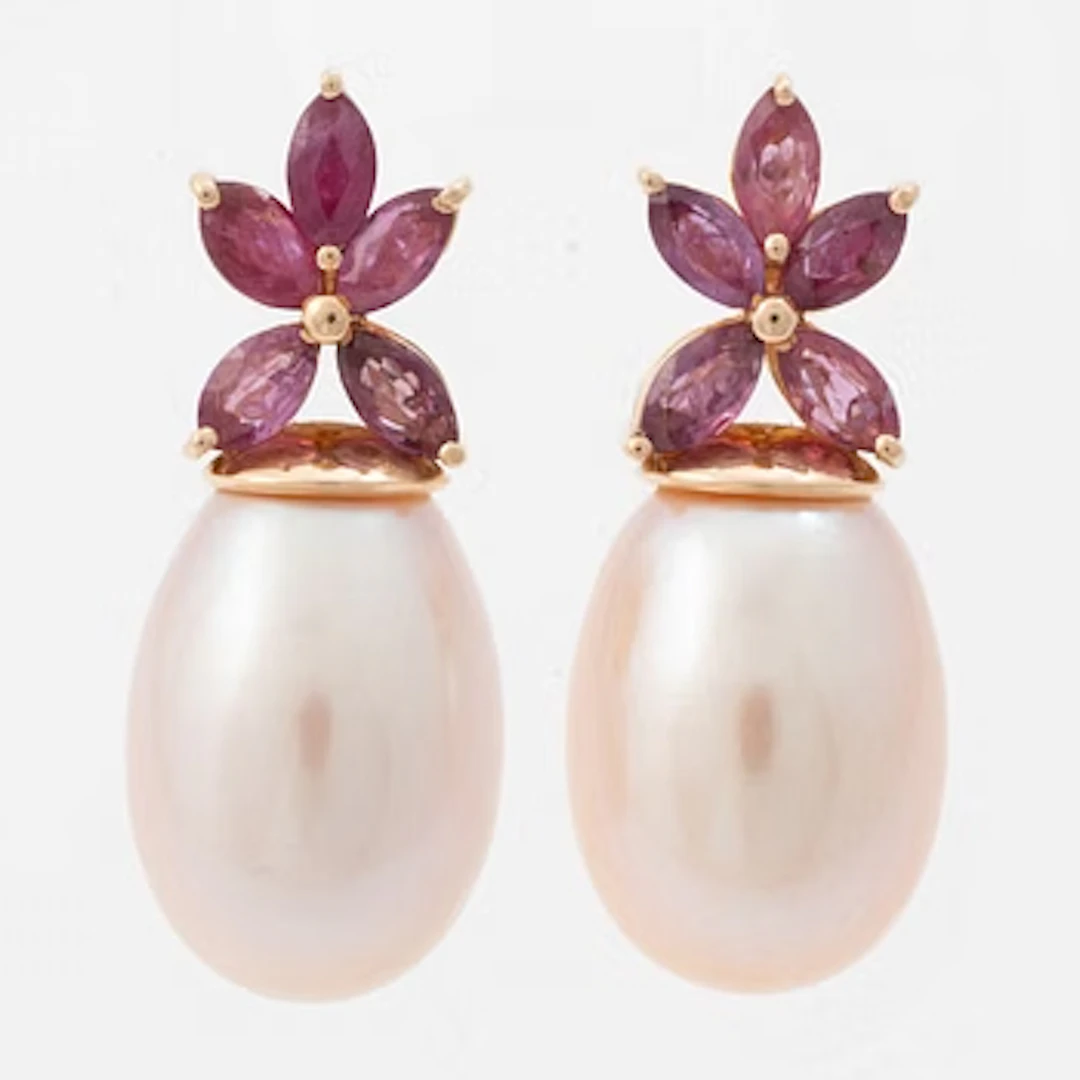 18K gold earrings with cultured freshwater pearls and navette-cut rubies.