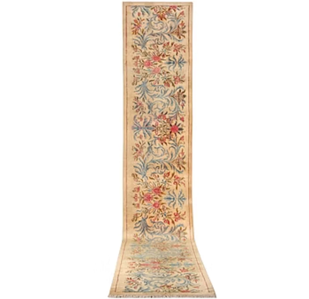 A semi-antique Keshan runner, c. 523 x 82 cm.