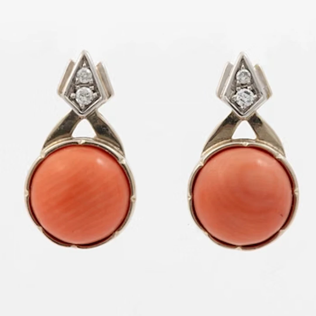 A pair of 14k white gold earrings with corals and diamonds ca. 0.10