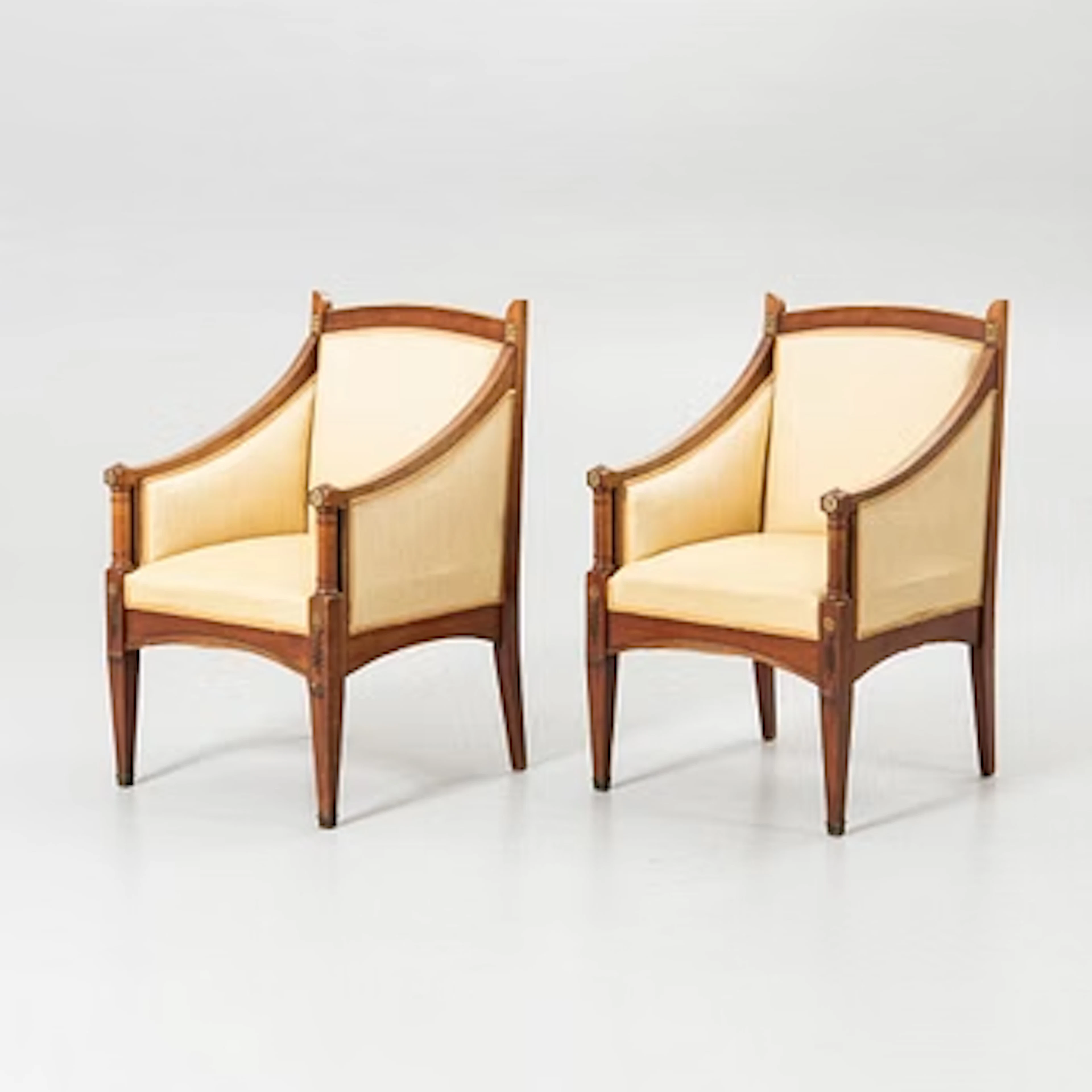 A pair of Empire-style armchairs, early 20th century.