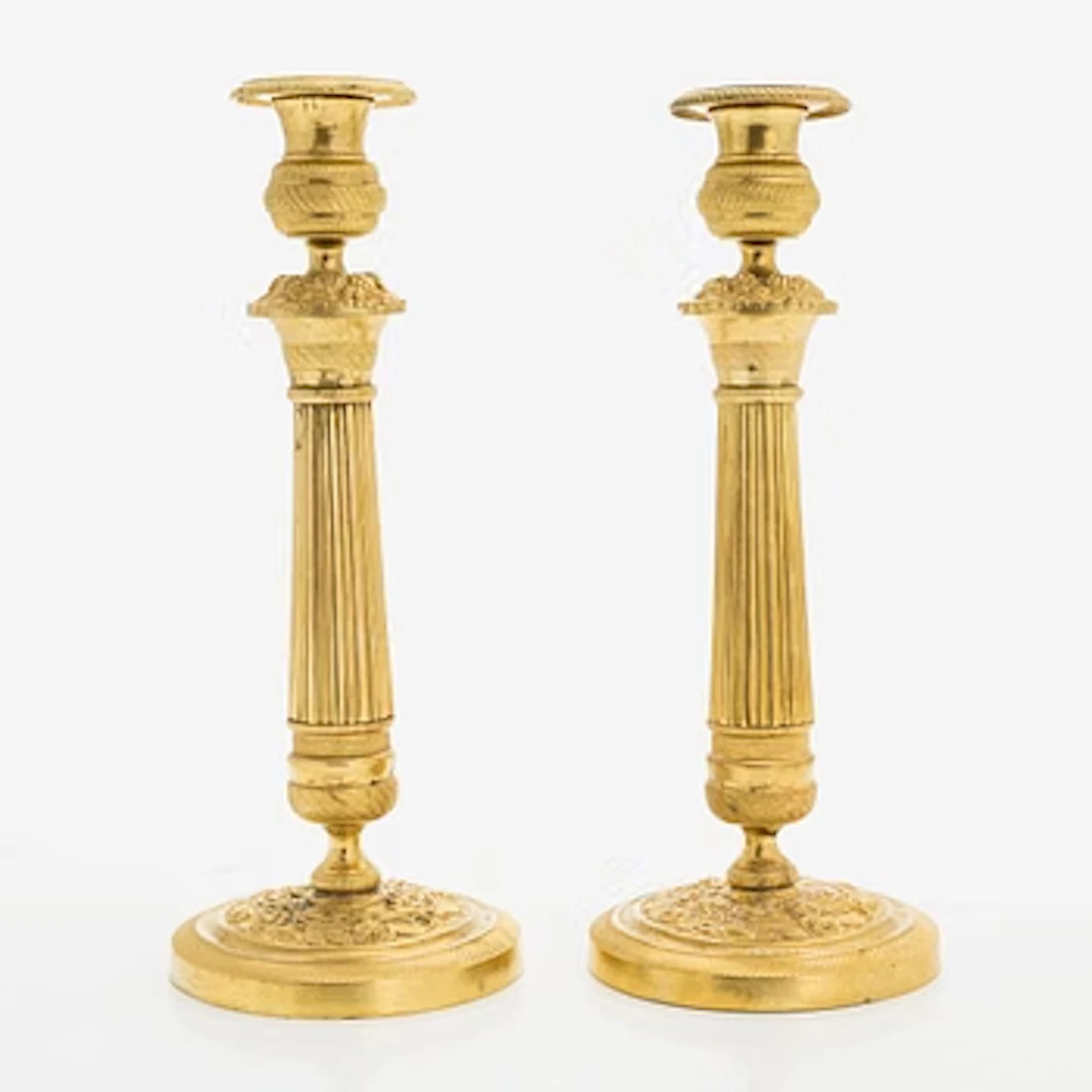 A pair of early 19th century French Empire candlesticks.