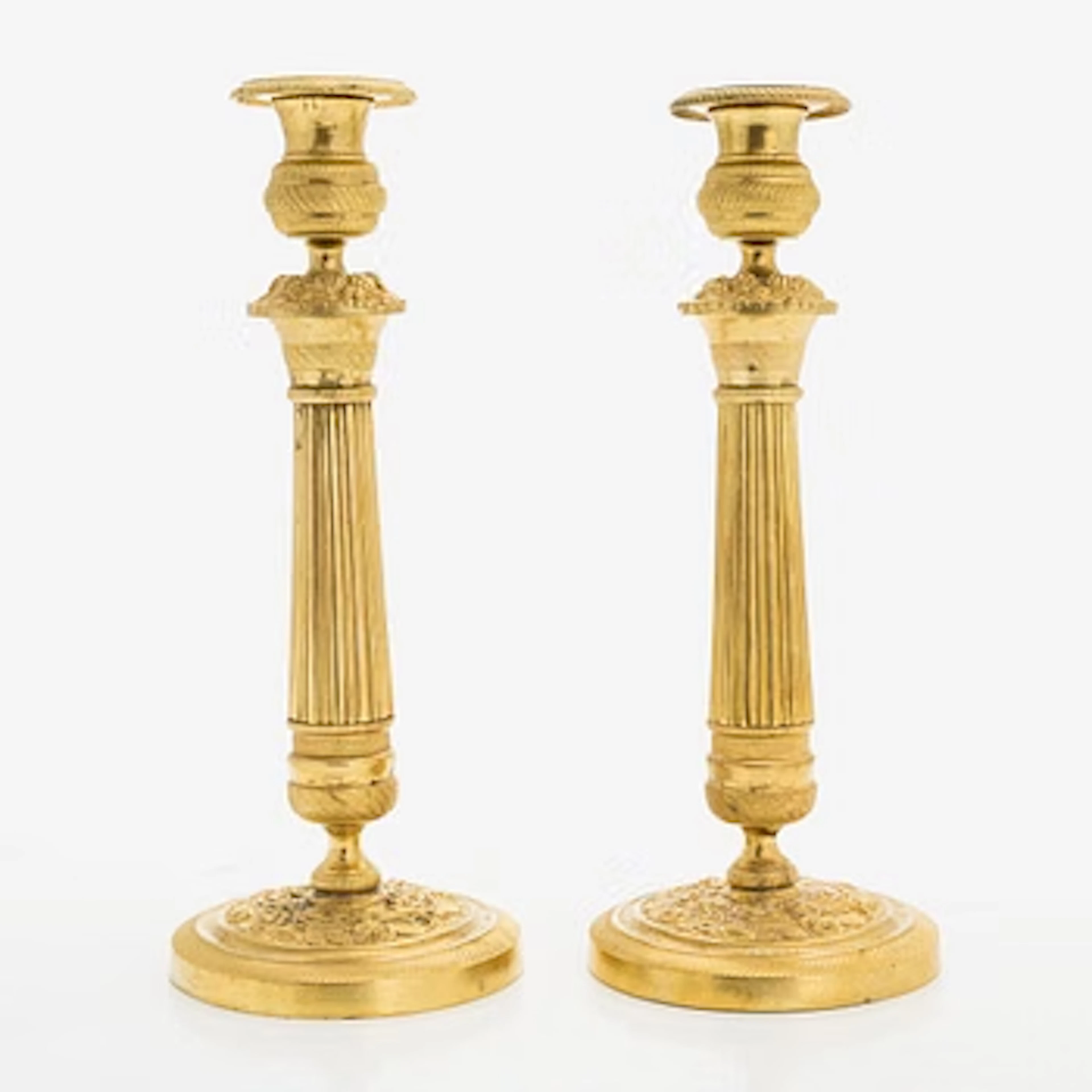 A pair of early 19th century French Empire candlesticks.
