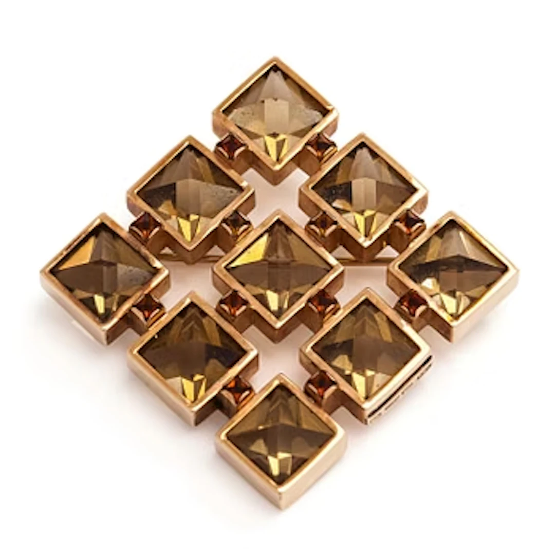 Olavi Nupponen, brooch, faceted smoky quartz and garnets, 14K gold