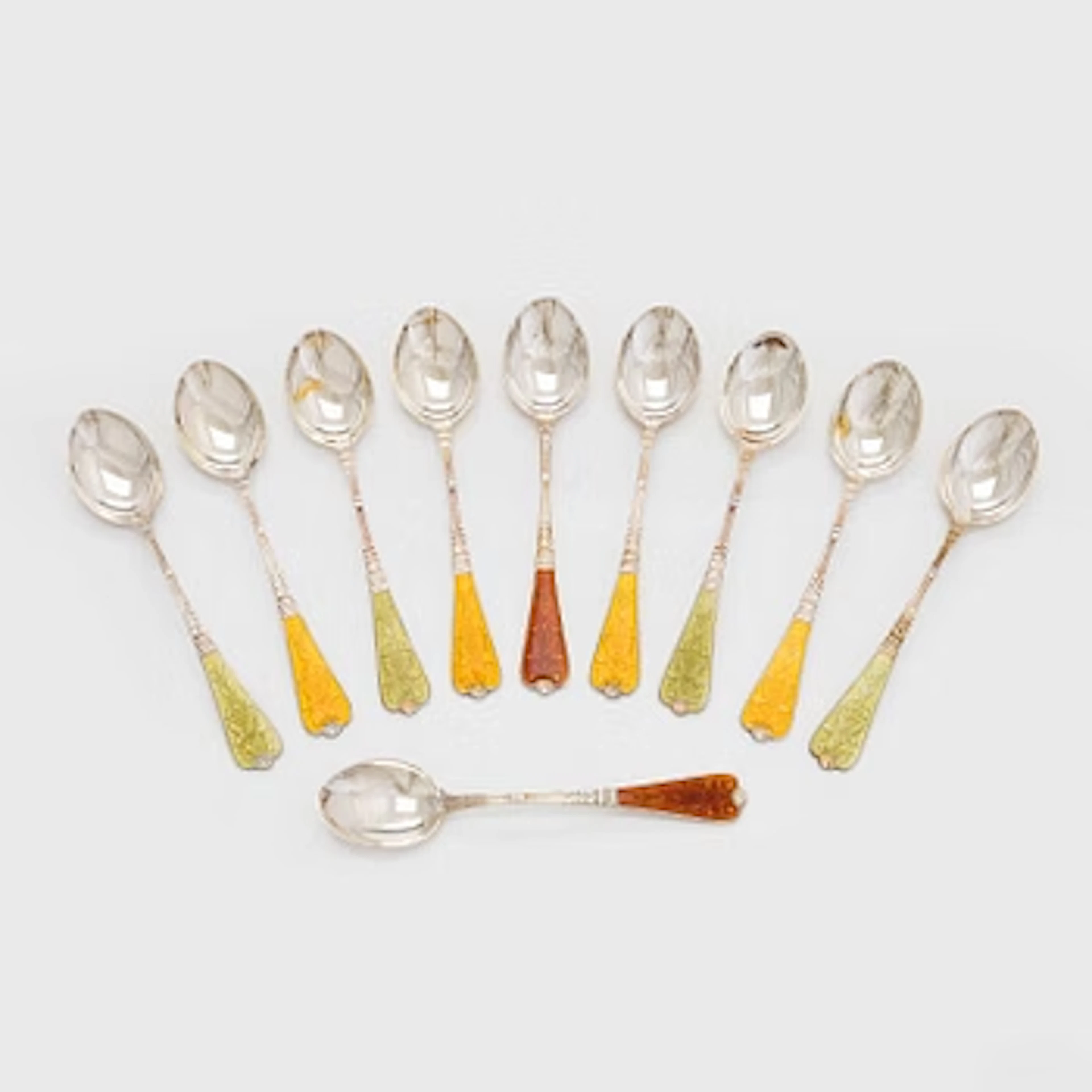 A ten-piece set of enamelled sterling silver coffee spoons, Auran