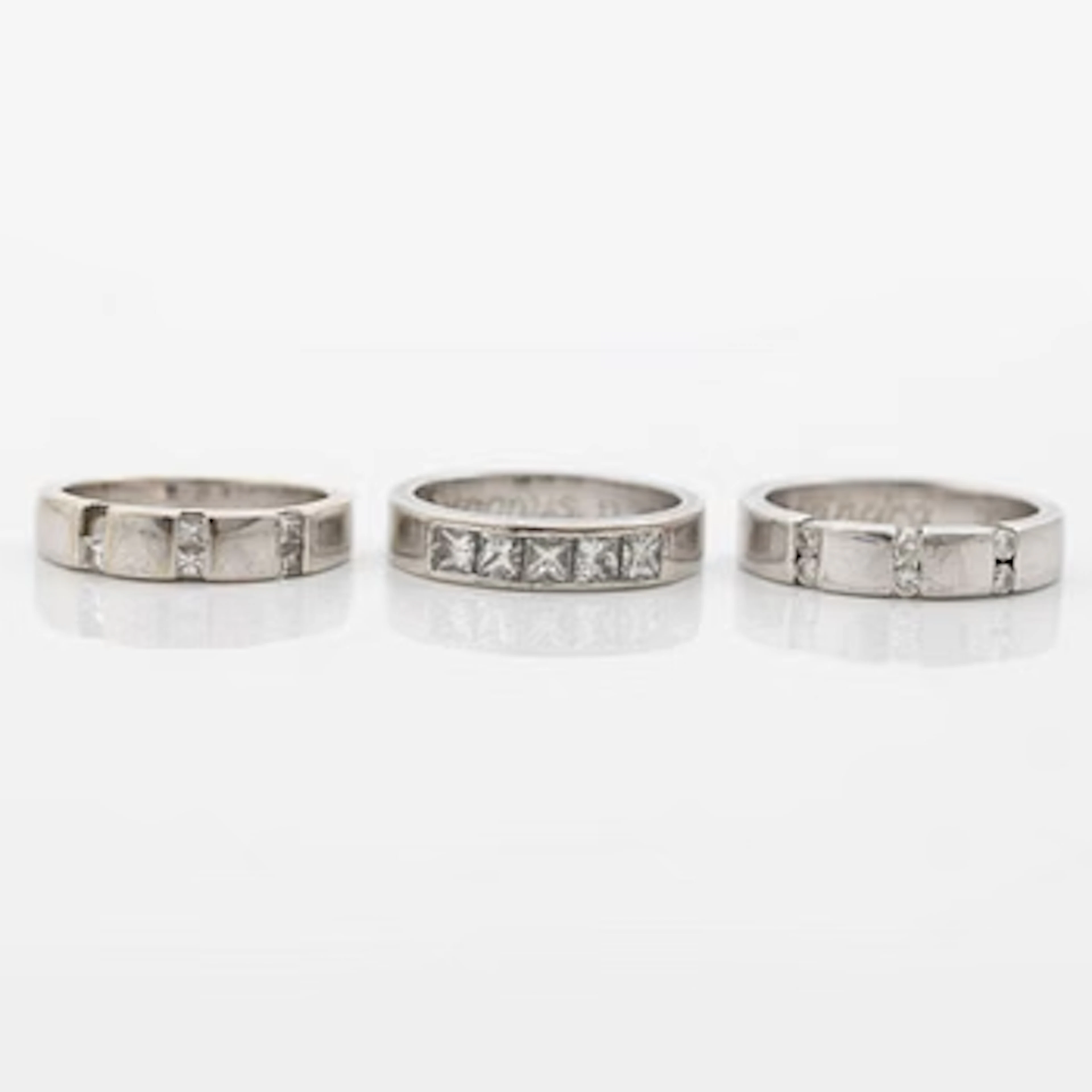 Three rings, 18K white gold with brilliant-cut and princess-cut diamonds.