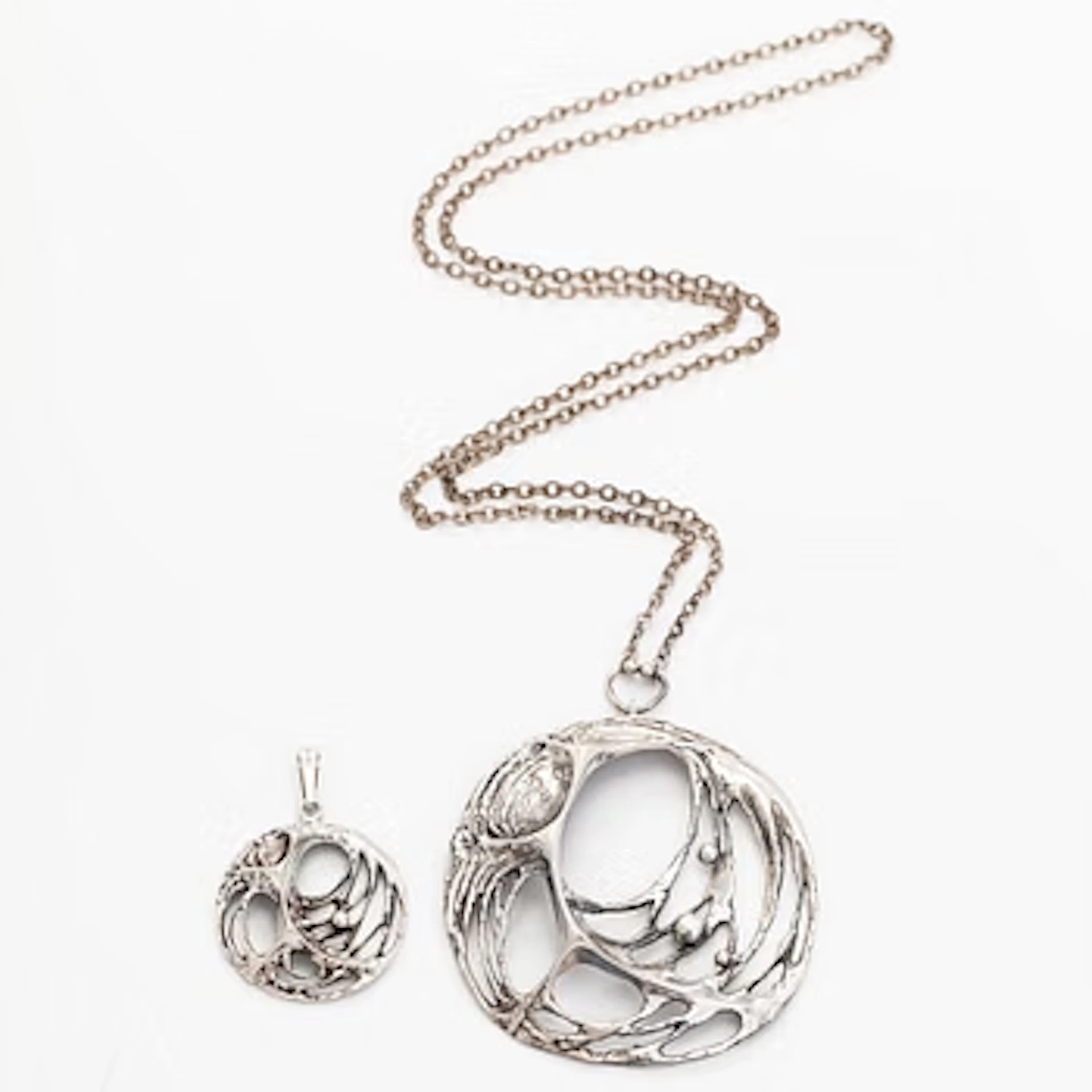 Karl Laine, pendants, “Spider Web”, 2 pieces, silver, Åbo, 1970s.