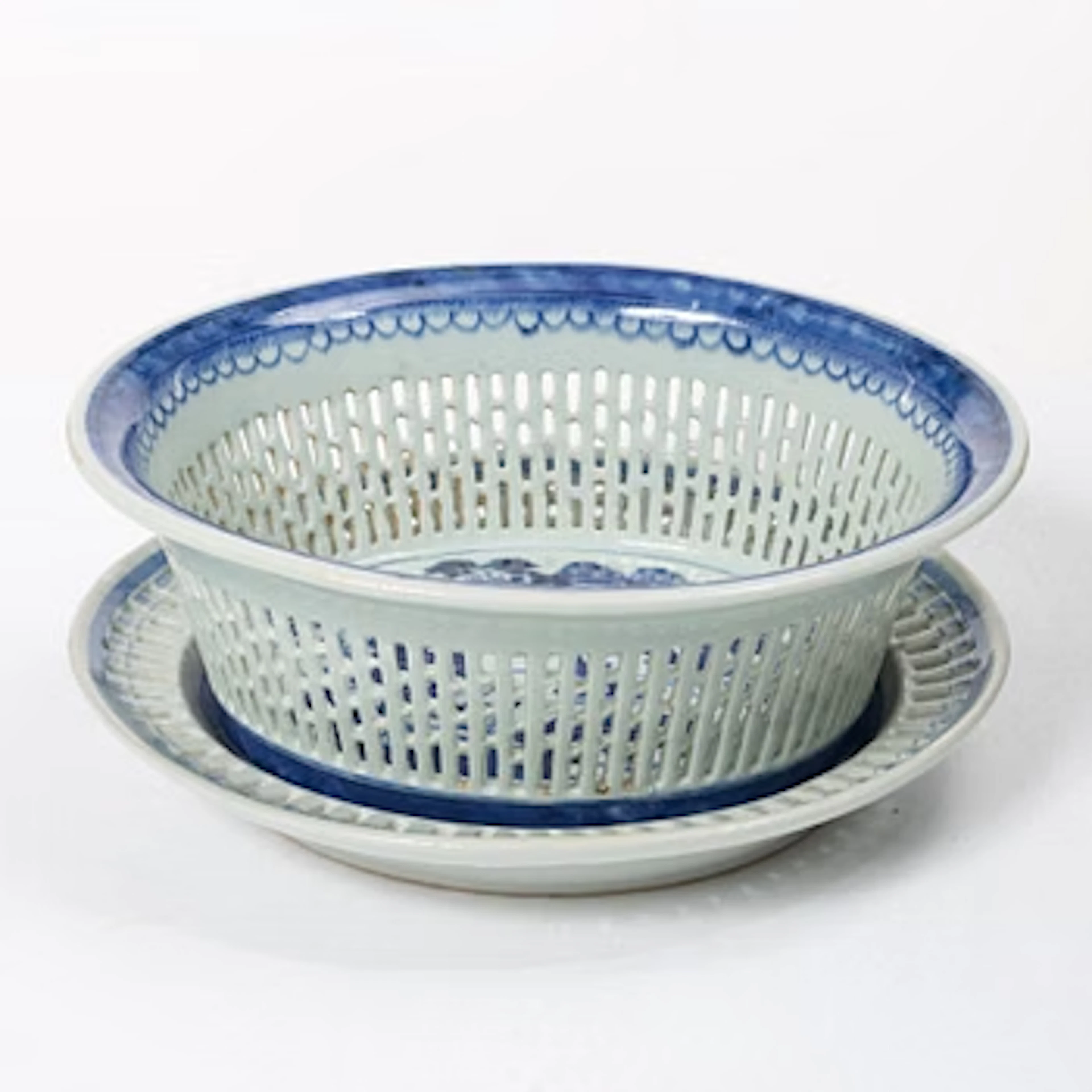 A Chinese blue and white chestnut basket with stand, Qing dynasty