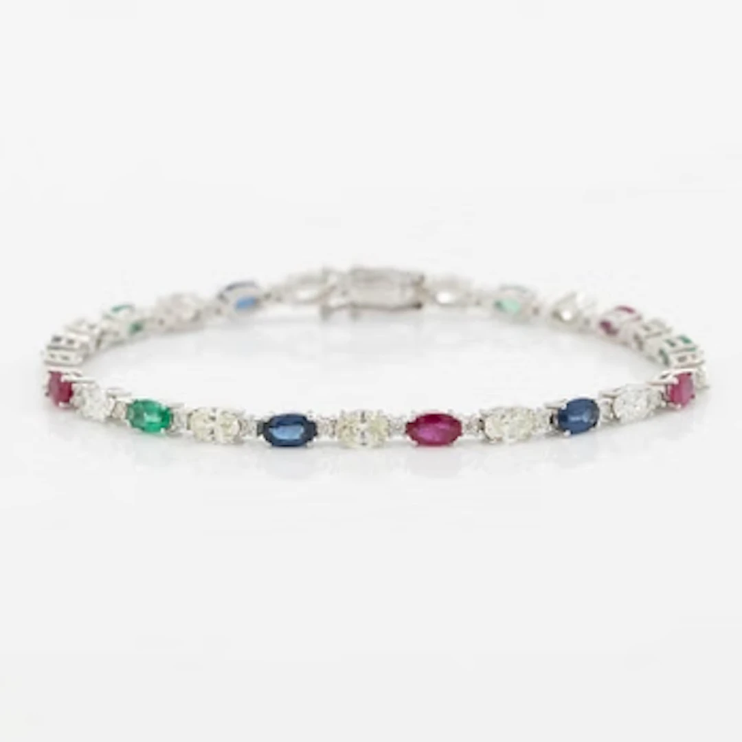 Bracelet 18K white gold set with faceted rubies, emeralds, sapphires