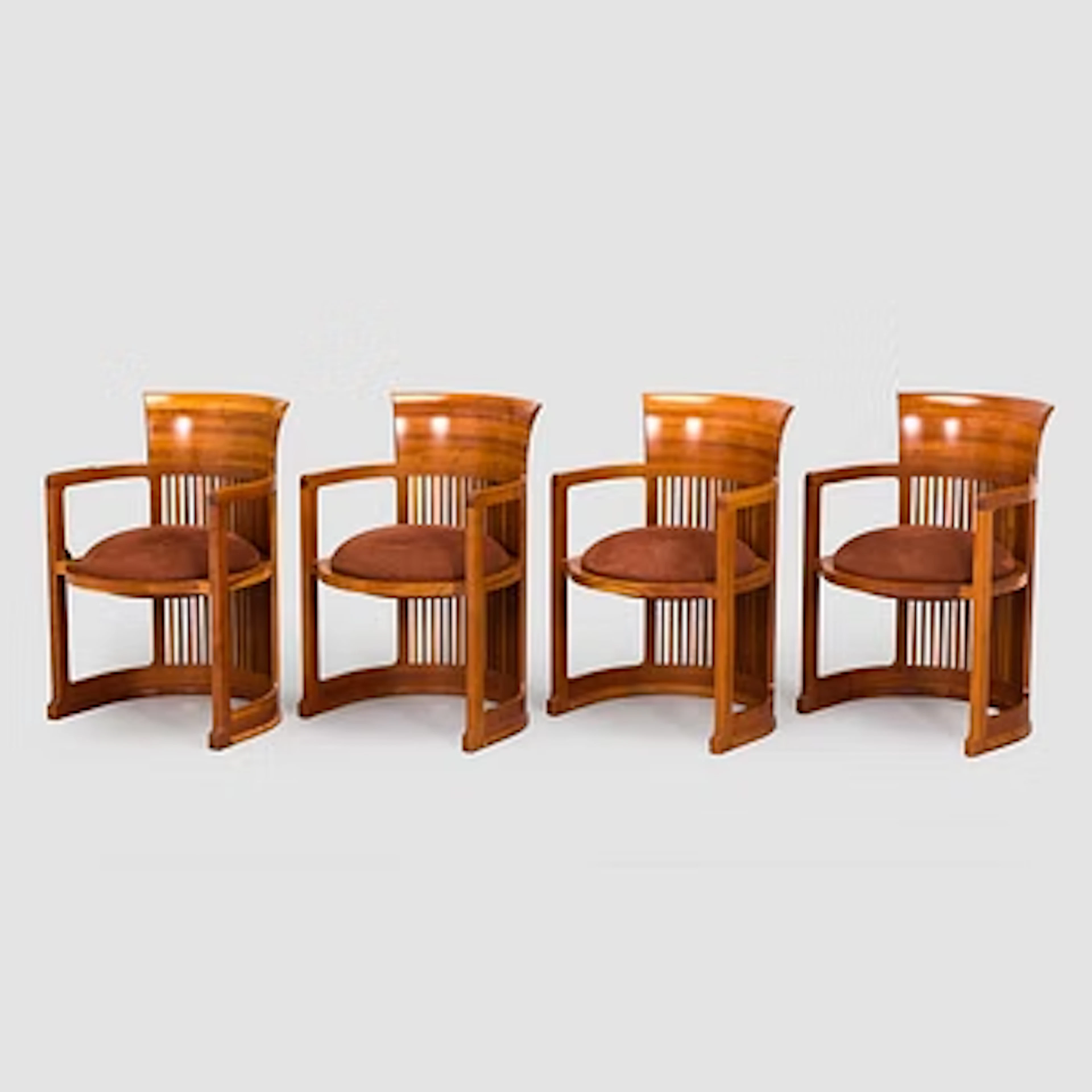Frank Lloyd Wright, a set of four armchairs, model no. 606, “Barrel”, Cassina.