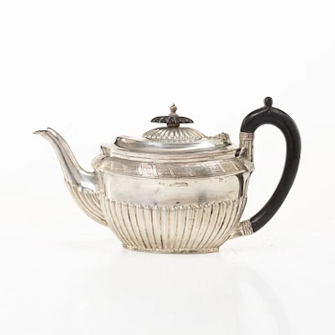 An English silver teapot, mark of Walker & Hall (John Edward Bingham)
