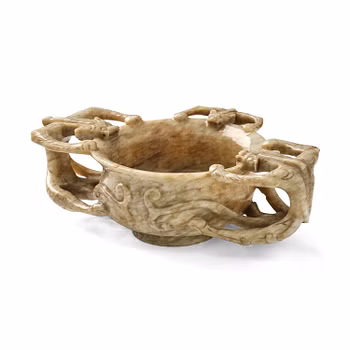 A large 'chicken-bone' jade chilong cup, Ming dynasty (1368-1644).