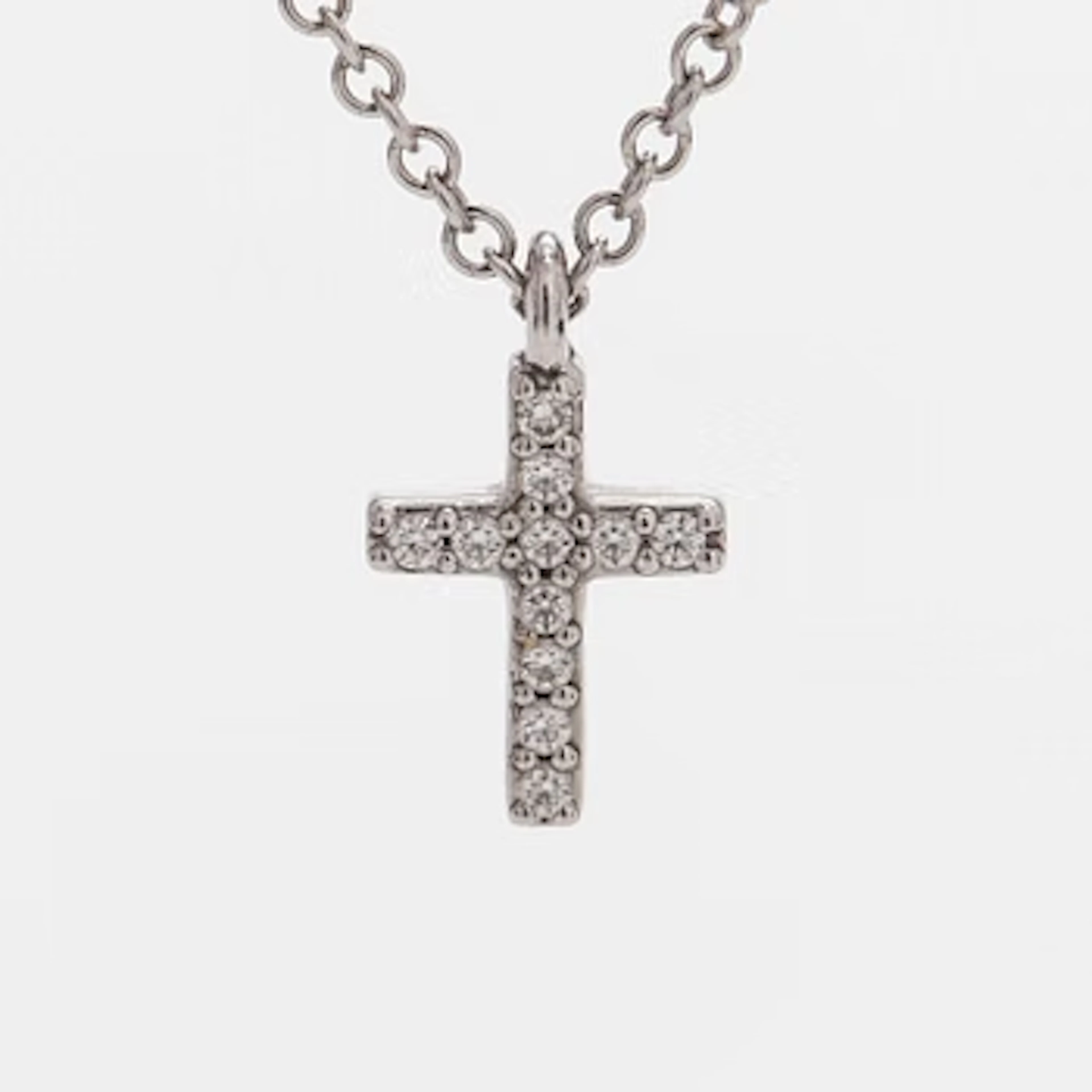 Tiffany & Co, an 18K white gold "Metro Cross" necklace with diamonds.