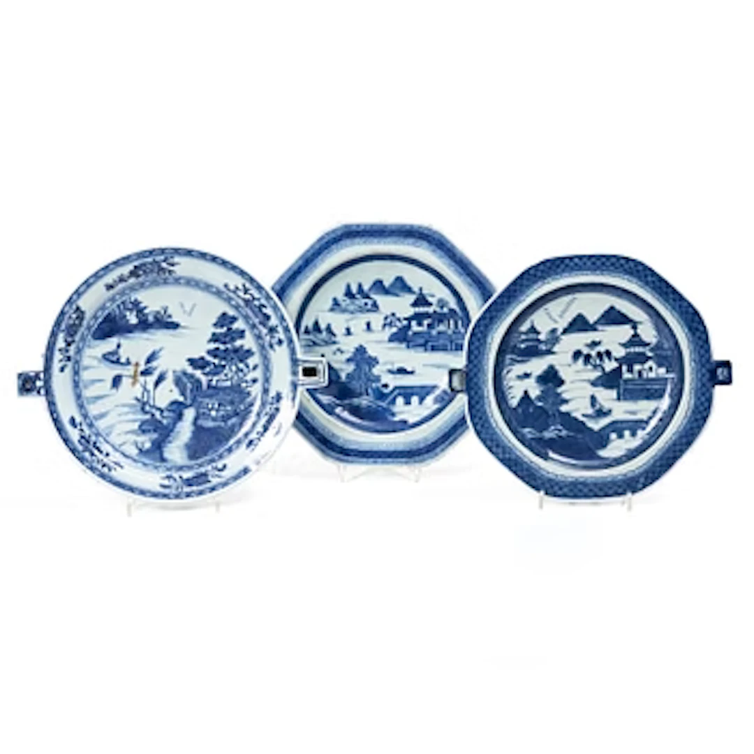 A group of three Chinese blue and white porcelain hot water dishes