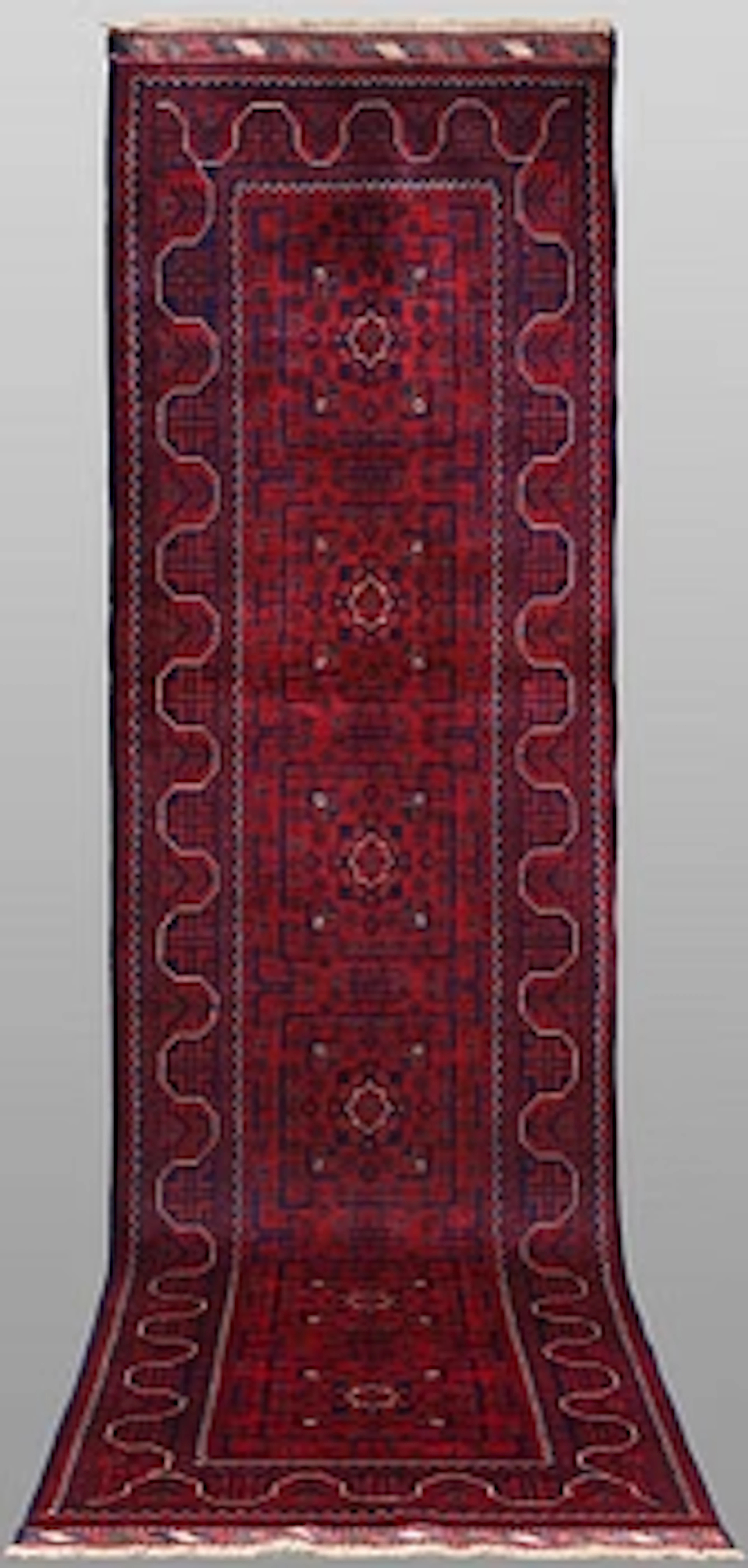 A Afghan runner carpet, 304 x 84 cm.