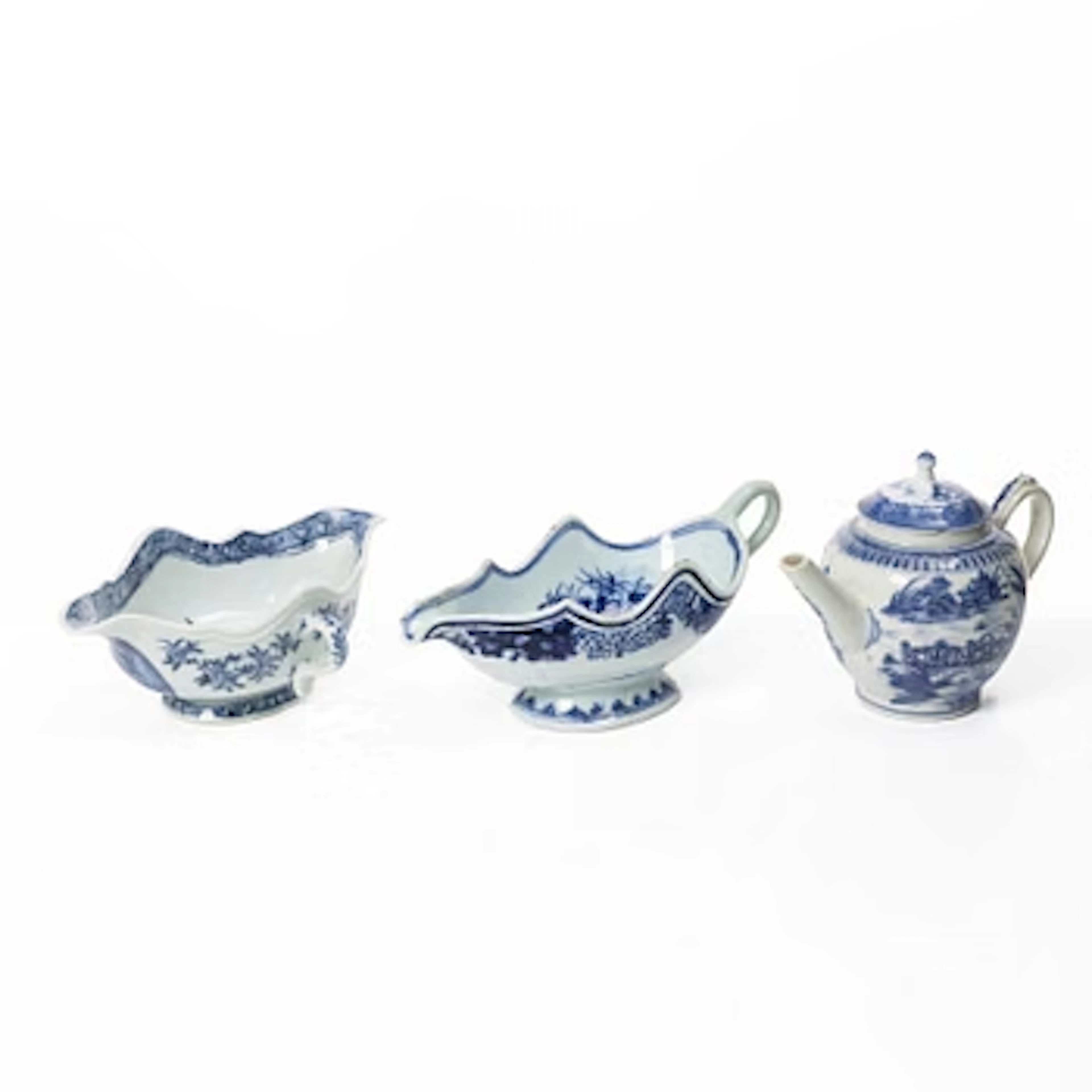 Two Chinese blue and white export porcelain sauceboats and a teapot