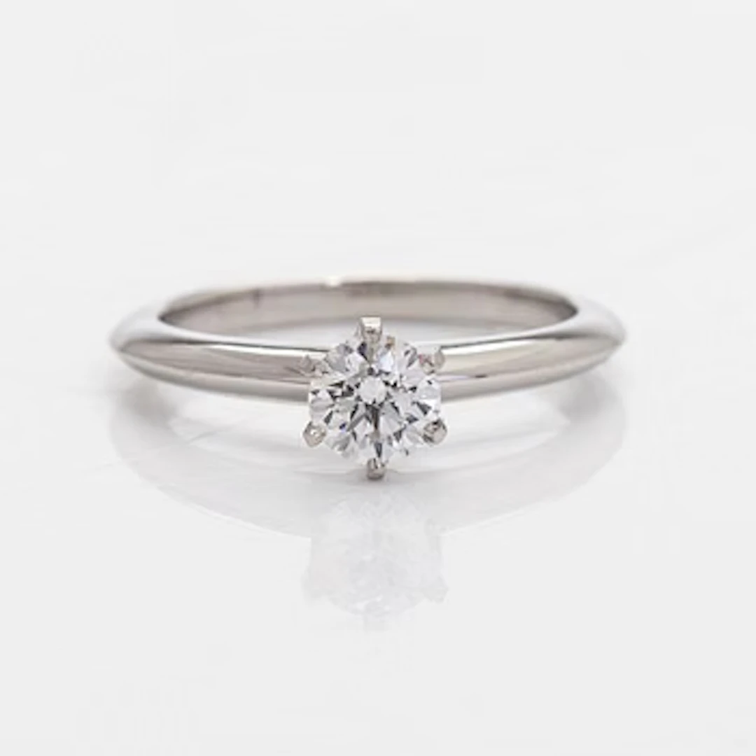Tiffany & Co, a platinum solitaire ring with a brilliant-cut diamond.