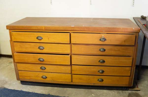 A wooden chest of drawers or counter, 20th century