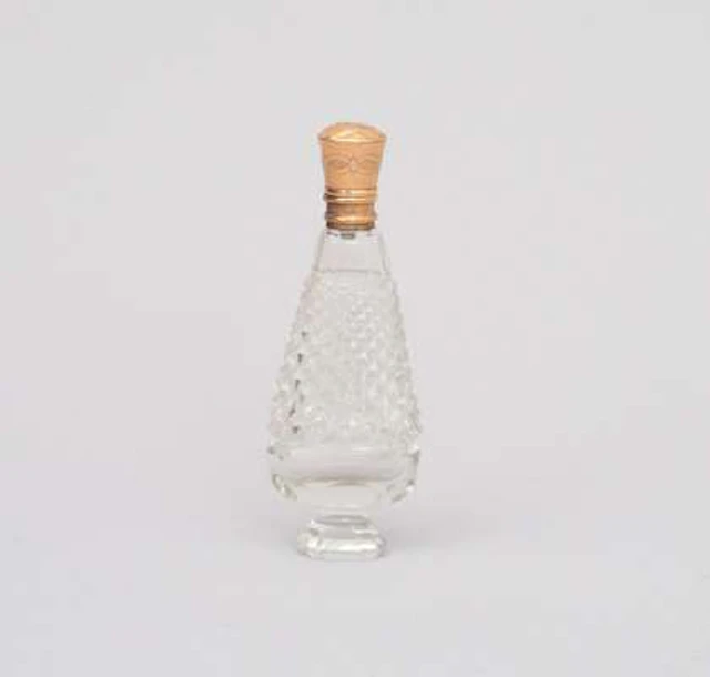 An antique crystal perfume bottle with 14k yellow gold cap. Holland ca. 1900.