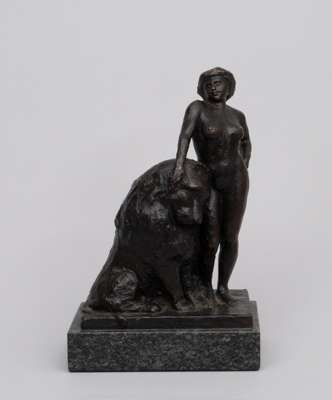 A bronze statue of woman with lion