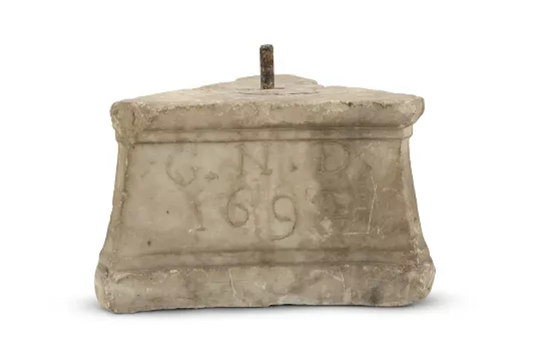 A WILLIAM AND MARY MARBLE CAPITAL OR COLUMN BASE, DATED 1692