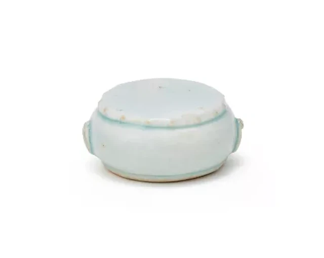 A Chinese qingbai glazed 'Drum' scroll weight, Southern Song (1127-1279)