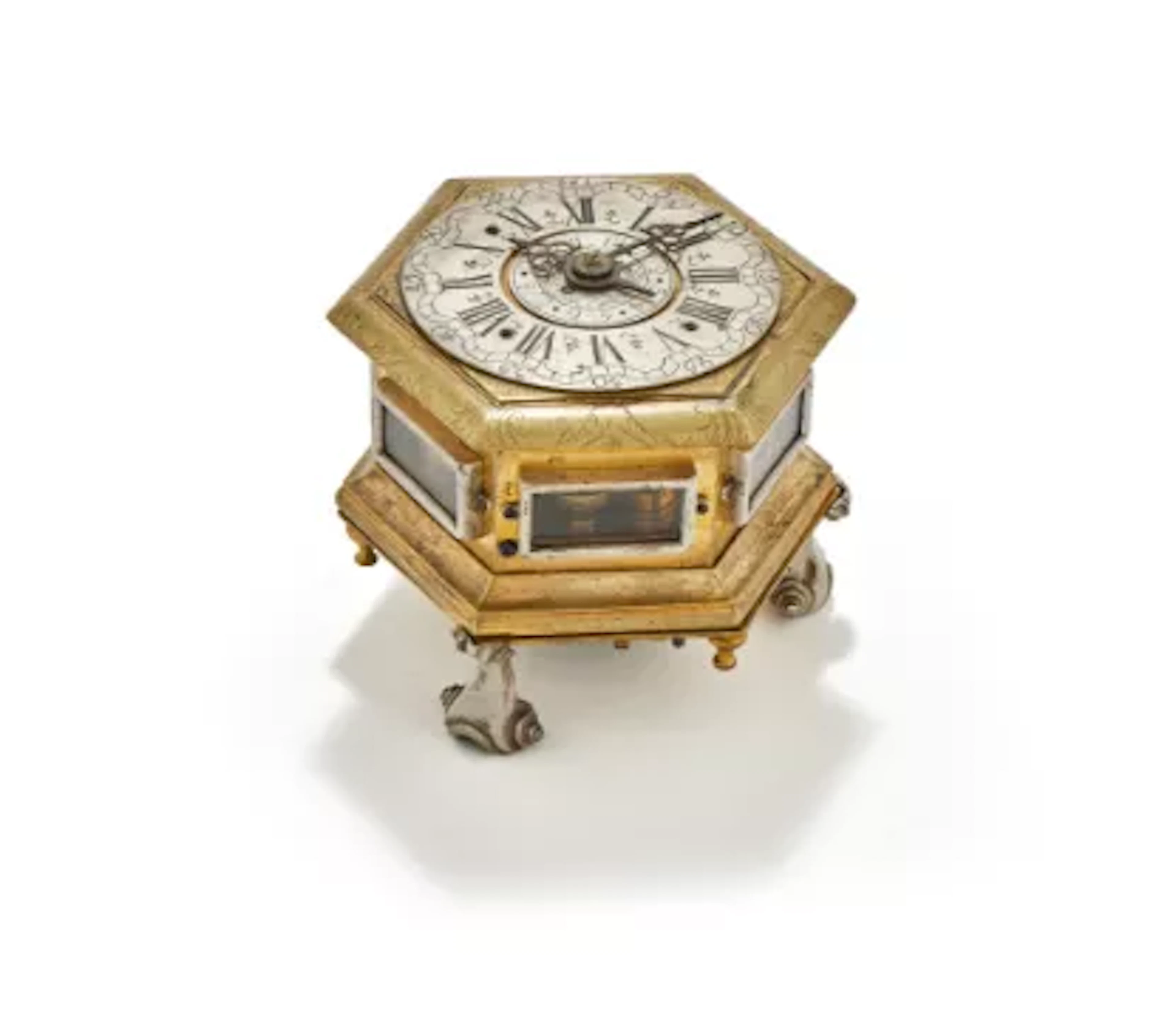 A POLISH GILT AND SILVERED BRASS HORIZONTAL HEXAGONAL TABLE CLOCK