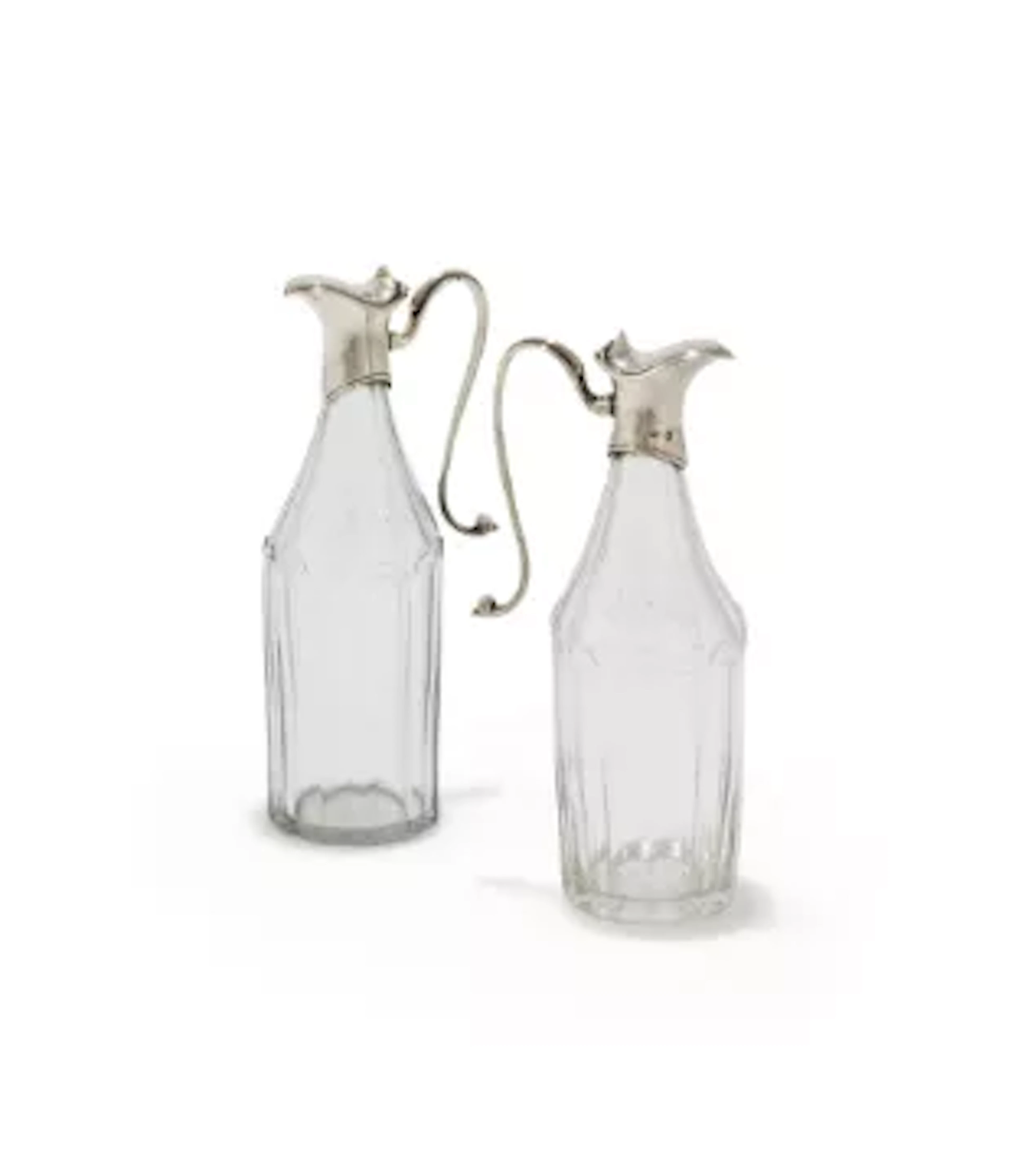 A PAIR OF SILVER MOUNTED AND FACETTED GLASS OIL BOTTLES, ROBERT HENNELL
