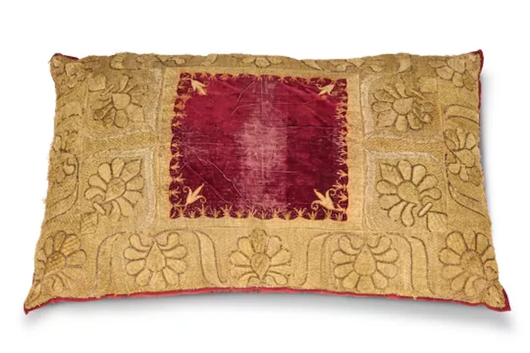 A LARGE GOLD THREAD EMBROIDERED RED VELVET CUSHION, MODERN INCORPORATING