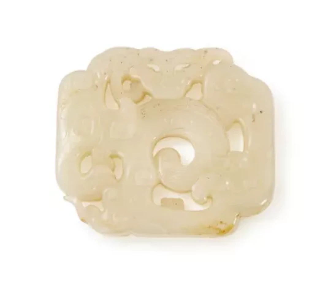 A fine Chinese white jade 'dragon' pendant, Qing dynasty, 18th century