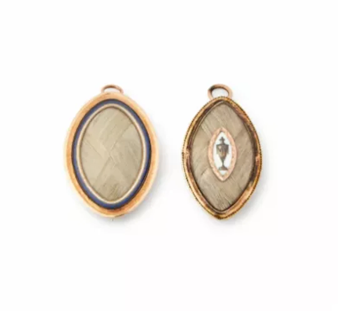 Y TWO GEORGE III HAIRWORK MOURNING PENDANTS, CIRCA 1784